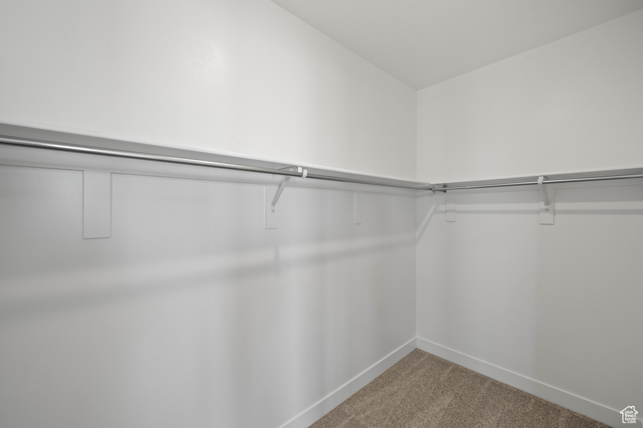 Spacious closet with carpet floors