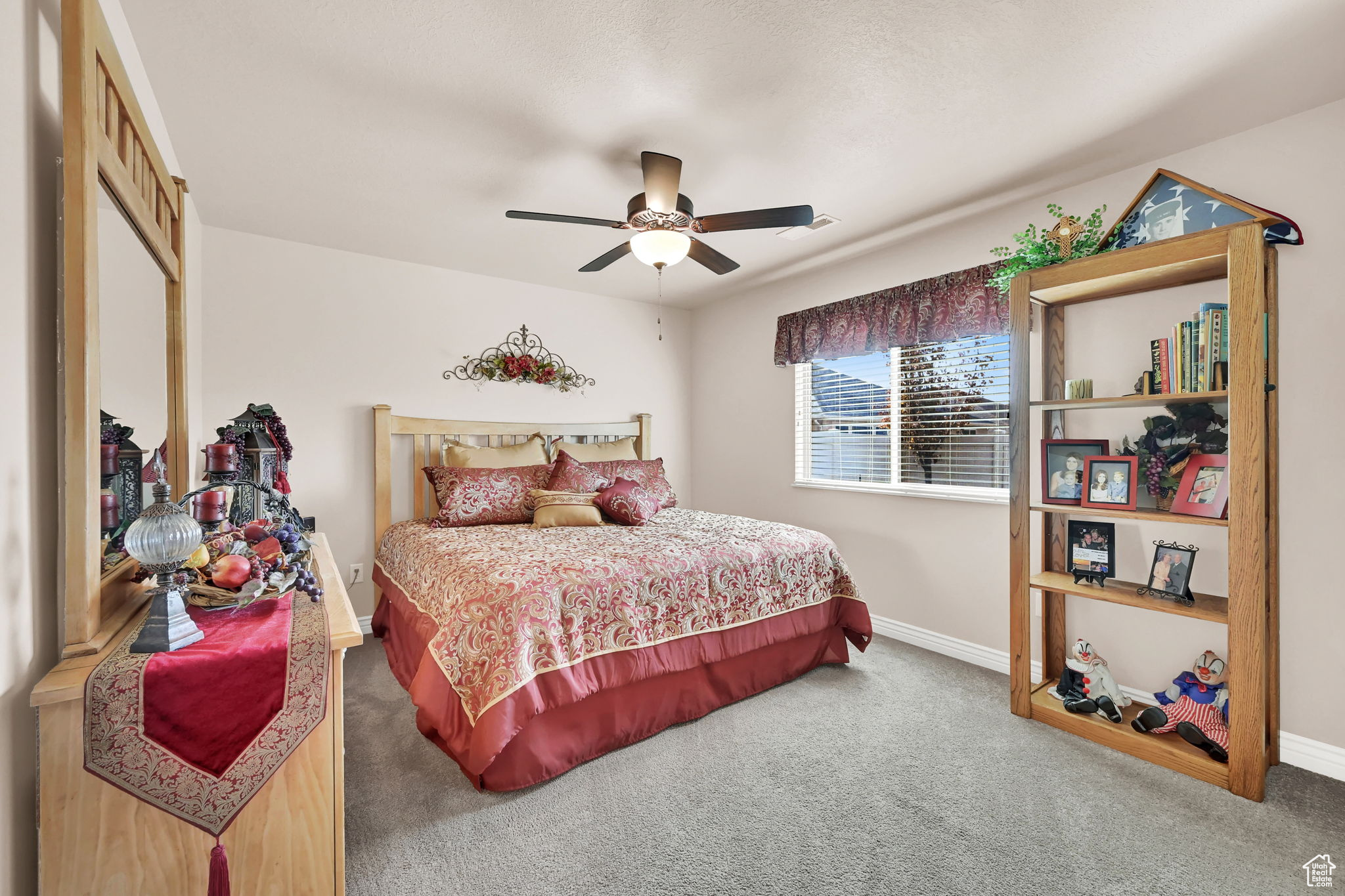 Bedroom with carpet flooring and ceiling fan