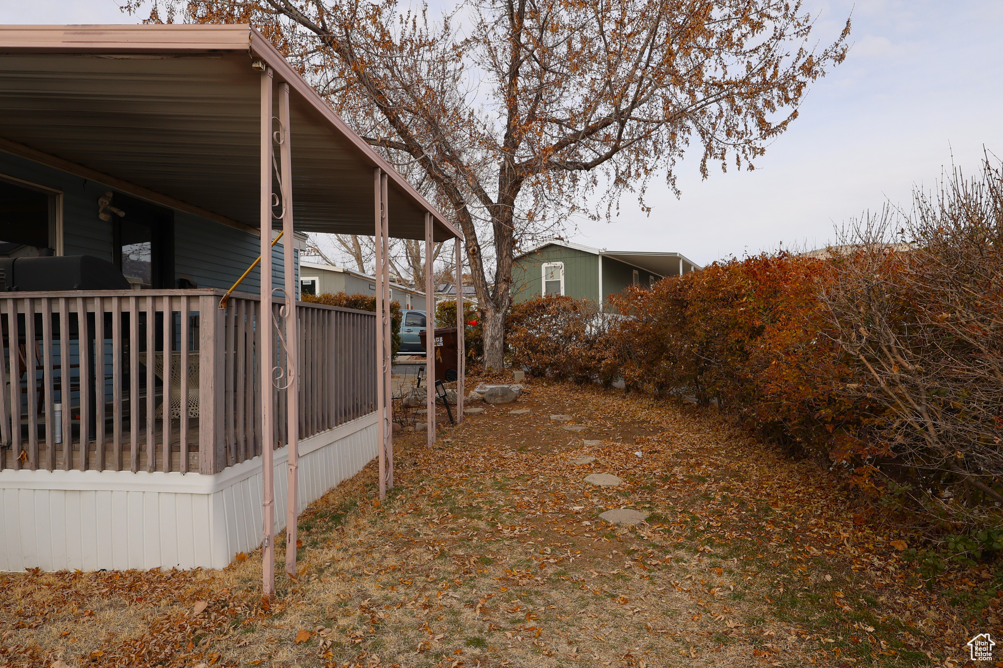 View of yard with a carport