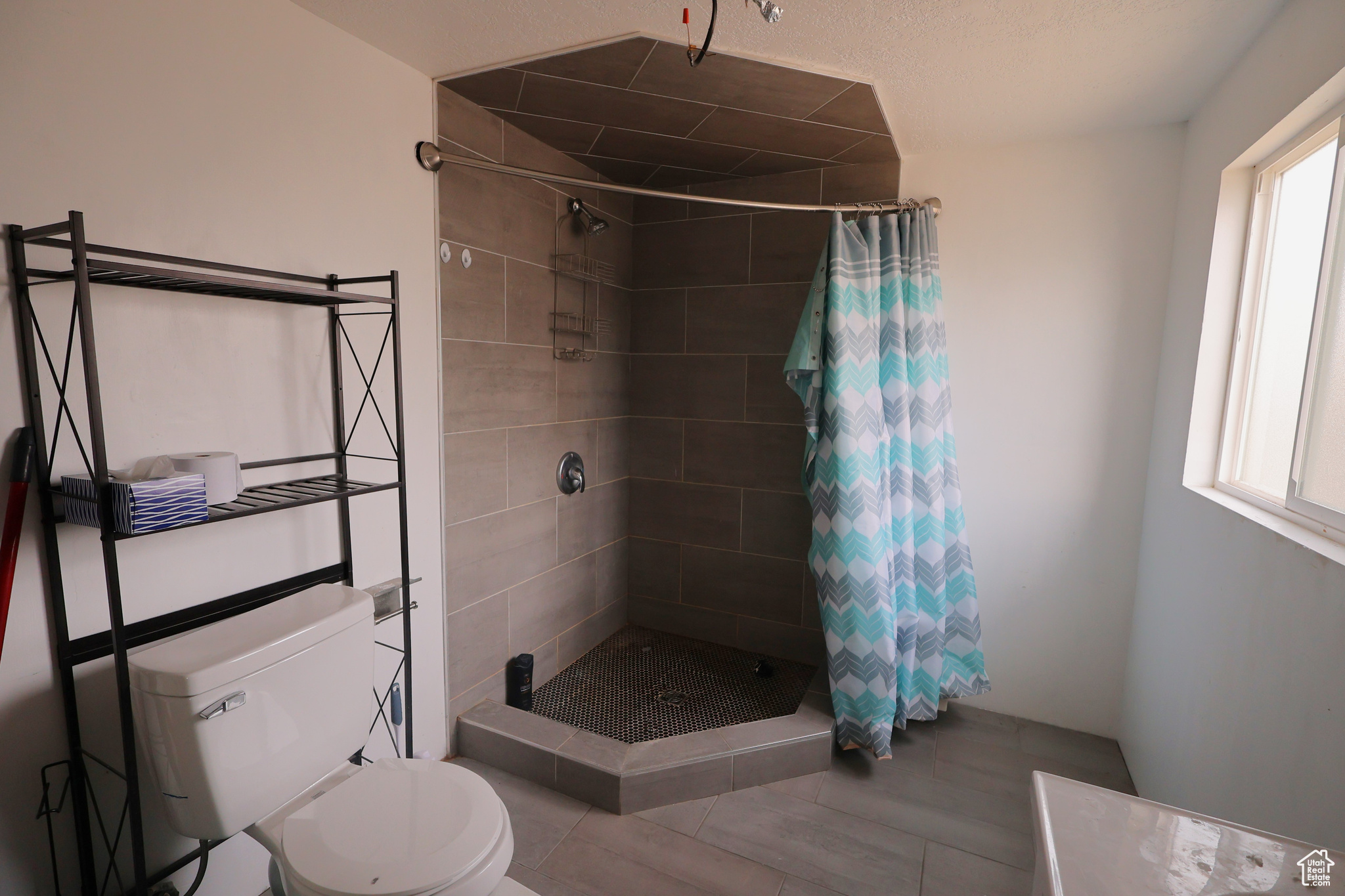 Bathroom with toilet and walk in shower