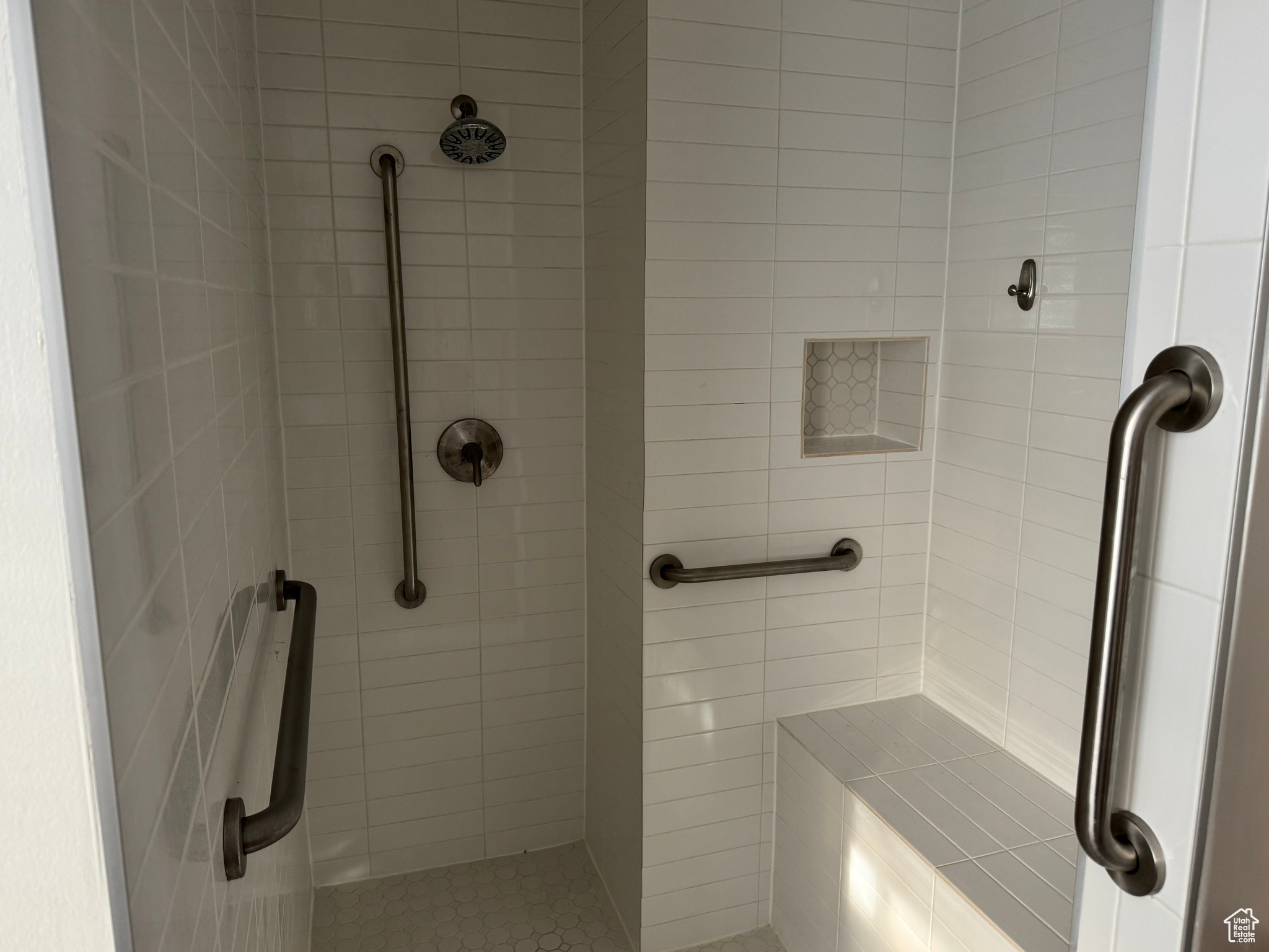 Bathroom featuring tiled shower