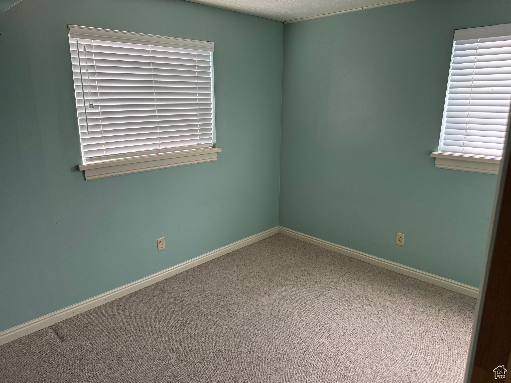 Spare room featuring carpet floors