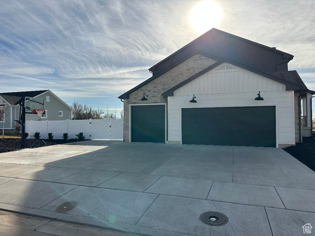 View of side of home with a garage