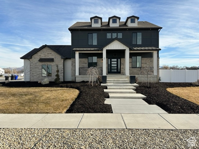 View of front of property featuring covered porch