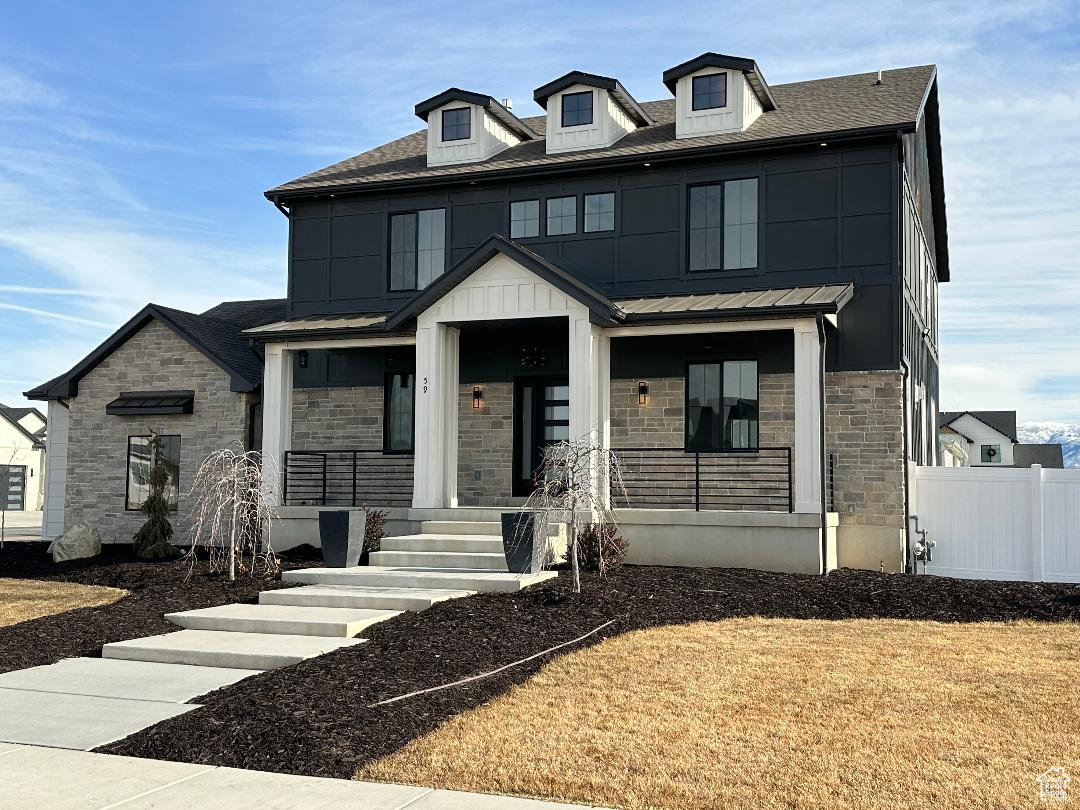 View of front of property featuring covered porch