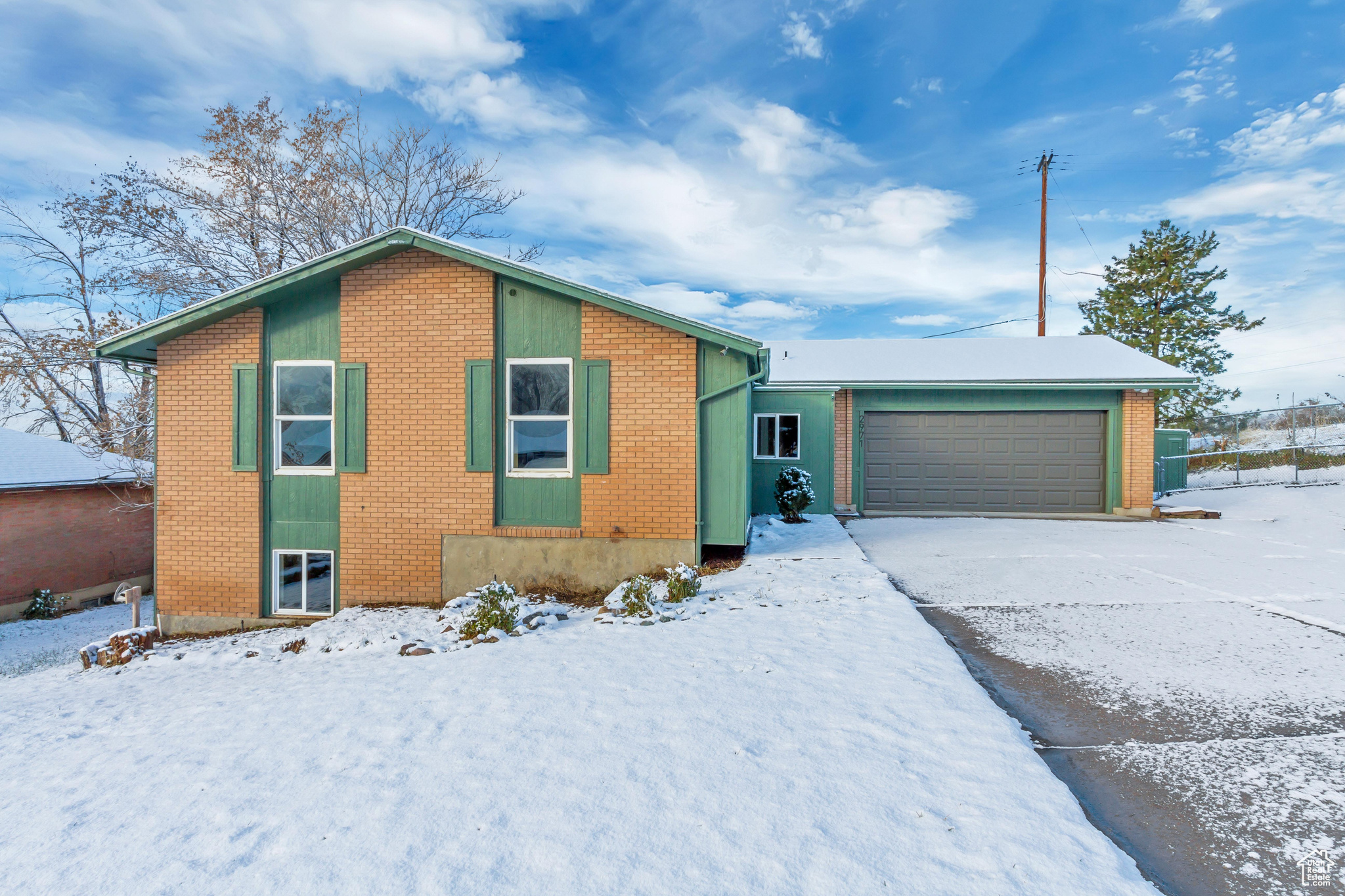 View of front of property featuring a garage