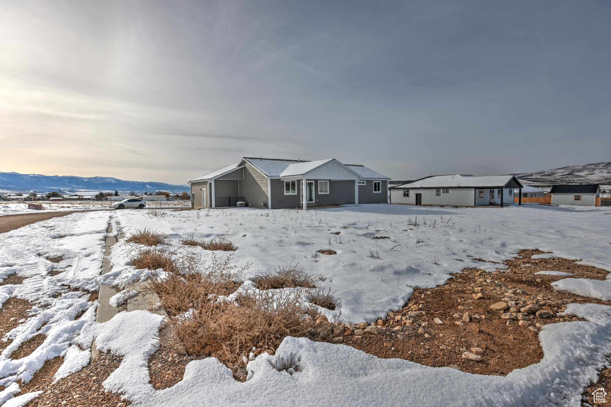 View of front of home featuring a mountain view