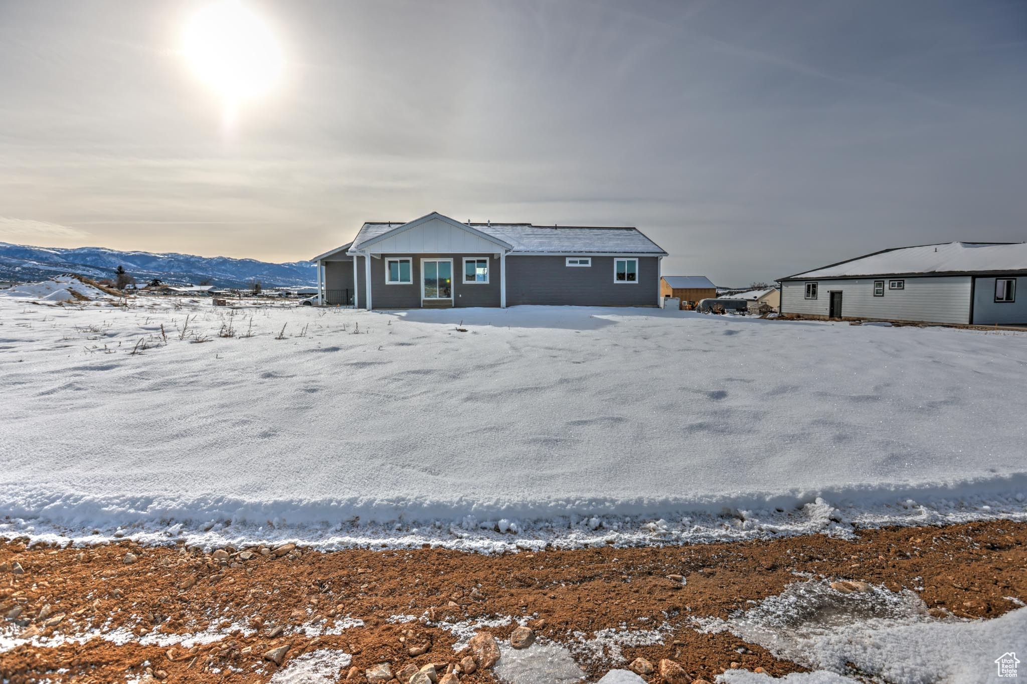 Snow covered property featuring a mountain view