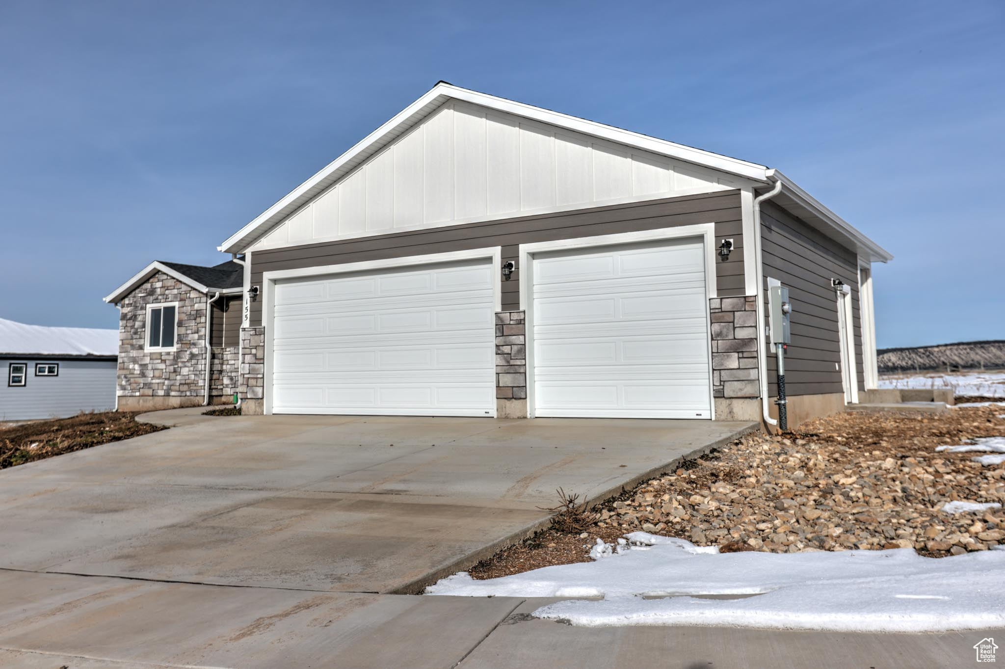 View of front facade featuring a garage