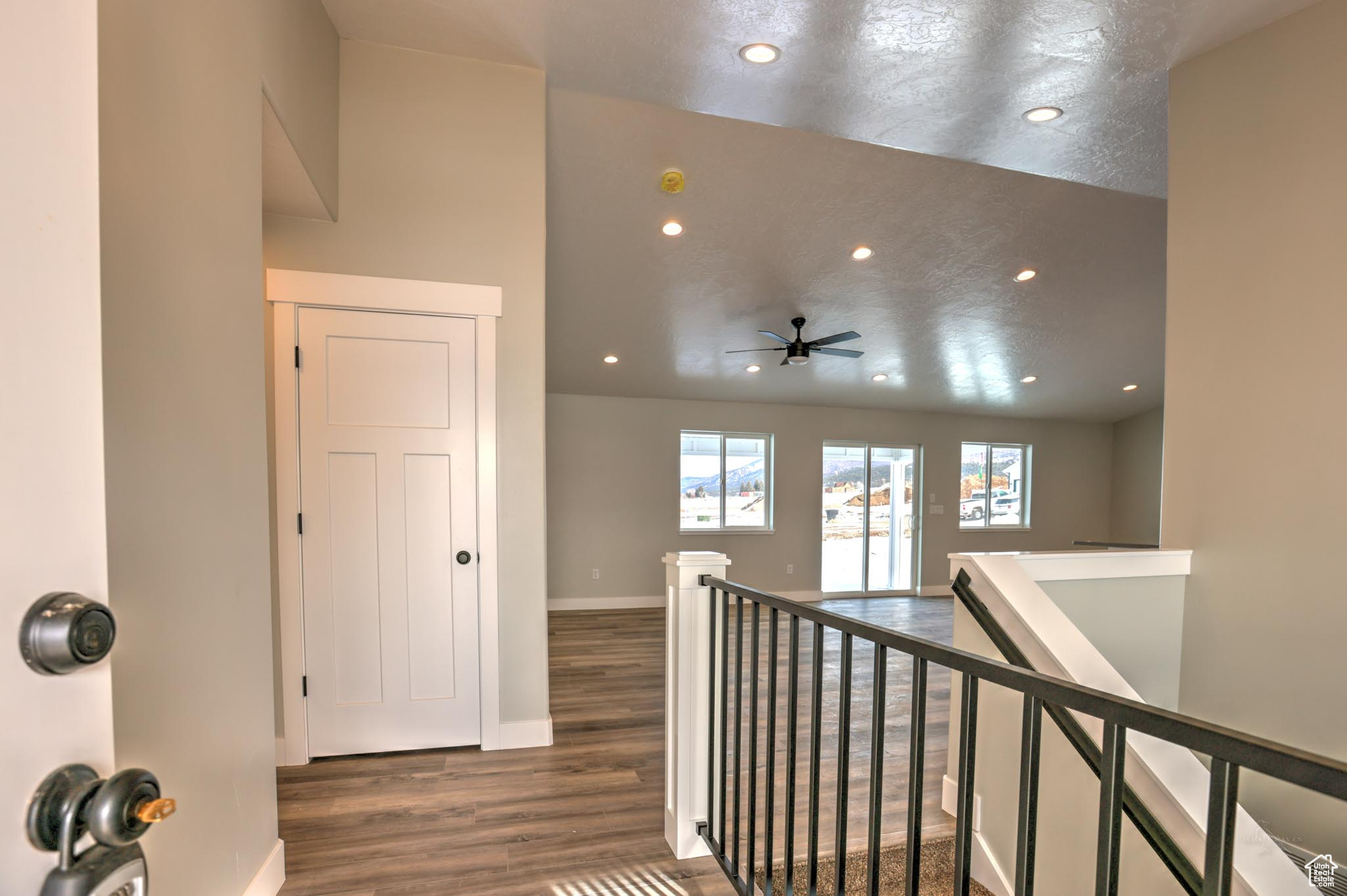 Corridor with dark hardwood / wood-style floors