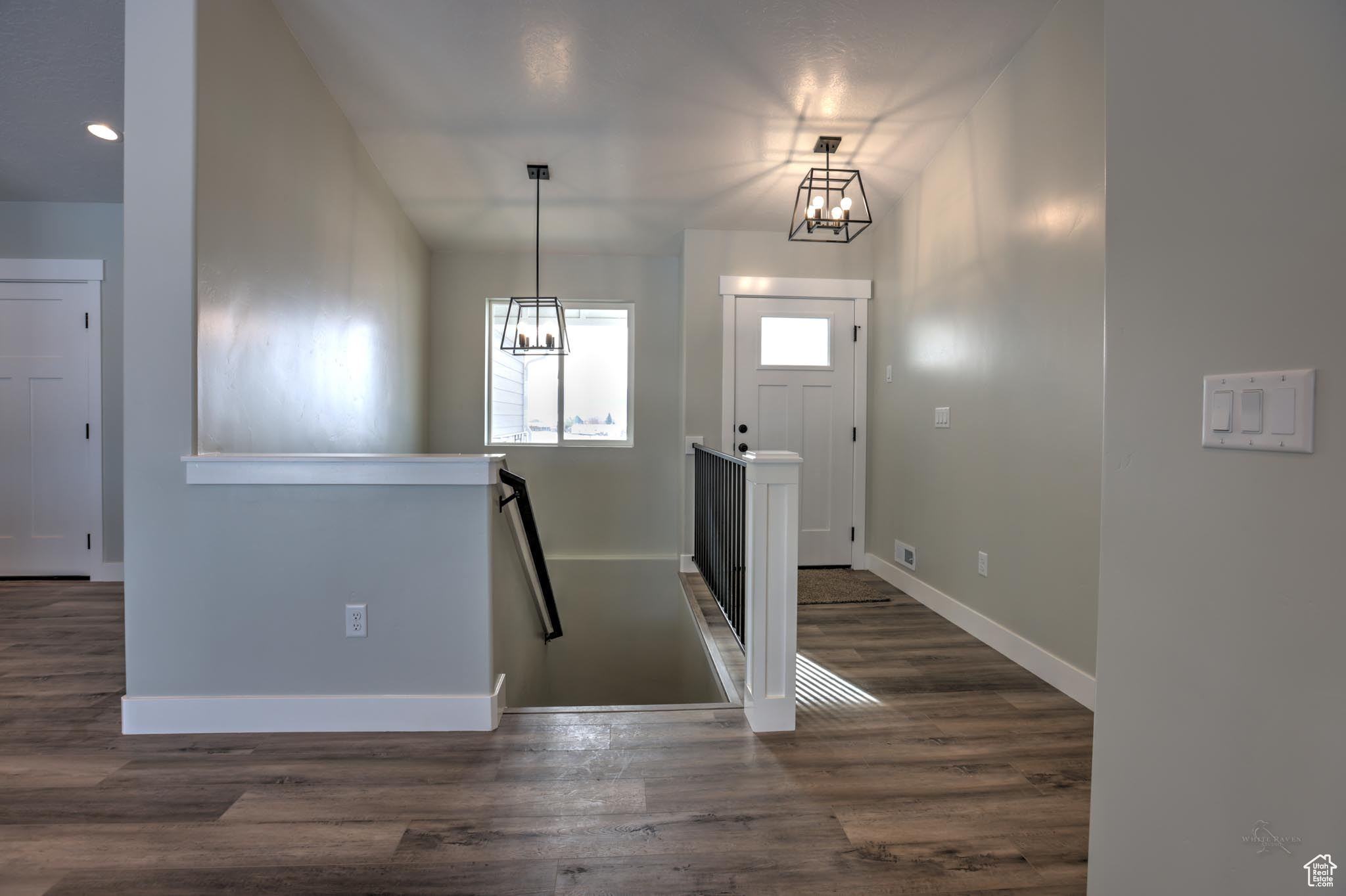 Entryway featuring dark wood-type flooring