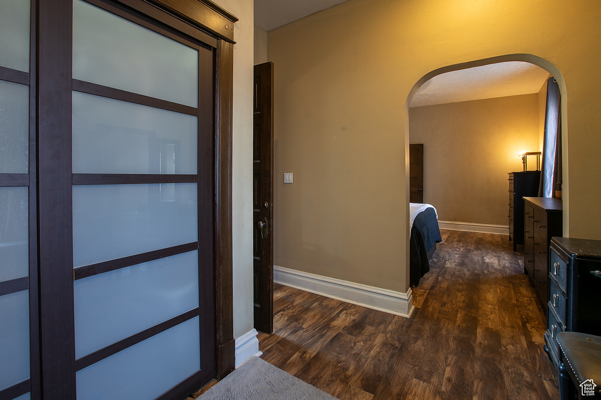 Corridor featuring dark hardwood / wood-style flooring