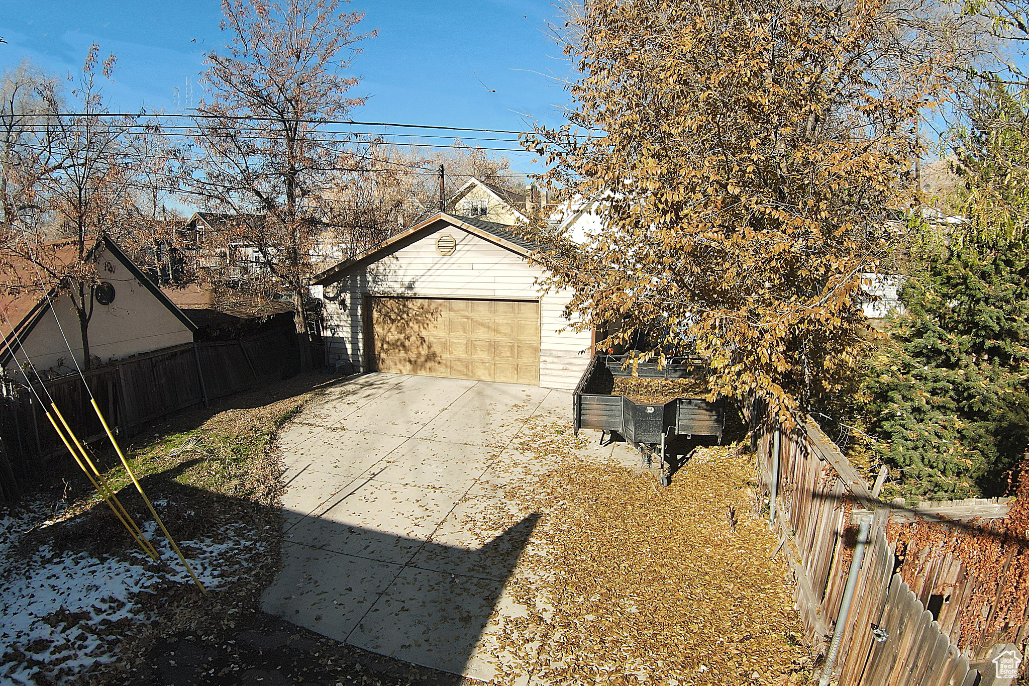 Exterior space with an outbuilding and a garage