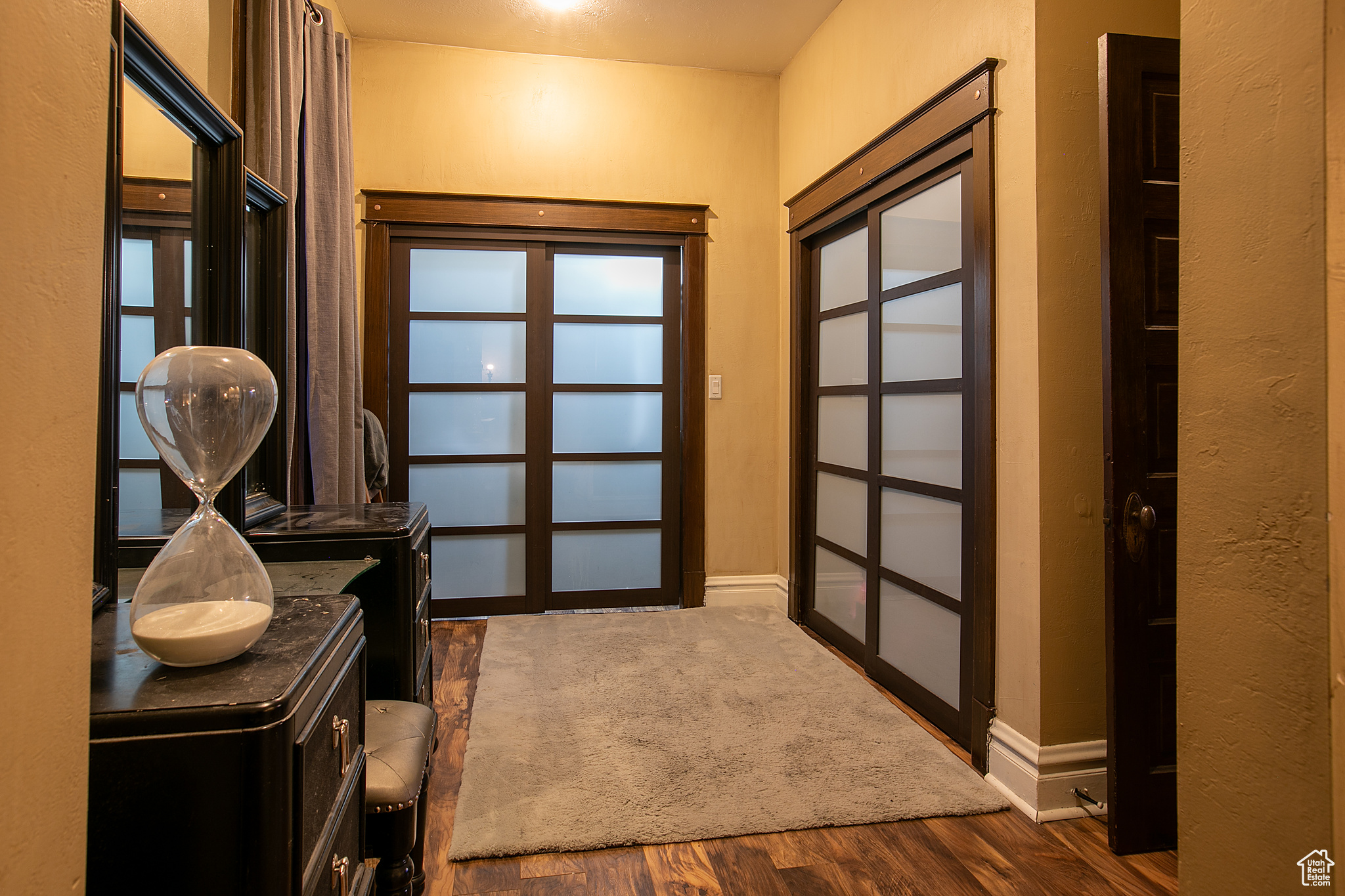 Doorway featuring dark hardwood / wood-style flooring