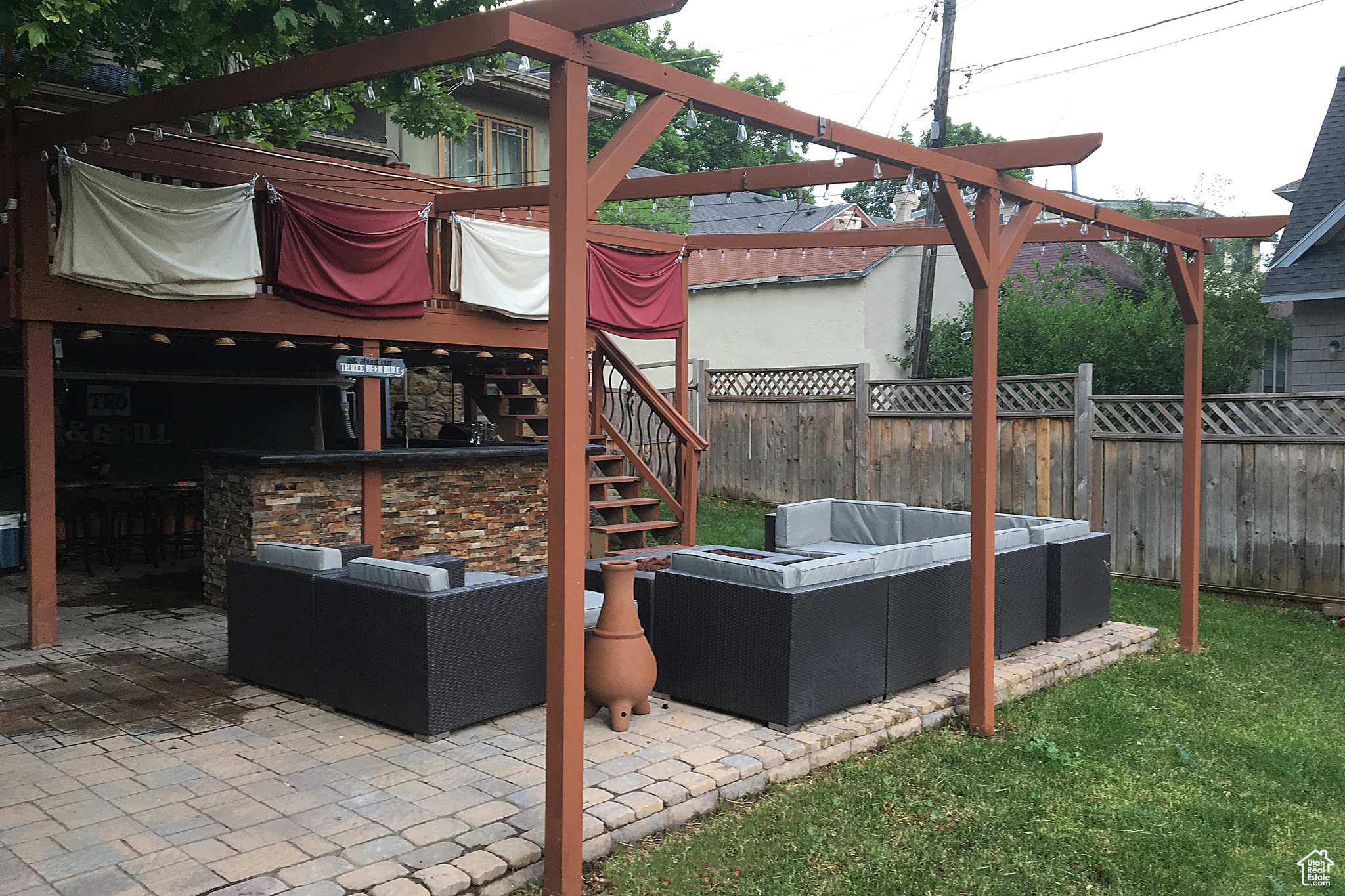 View of patio featuring an outdoor bar and an outdoor hangout area