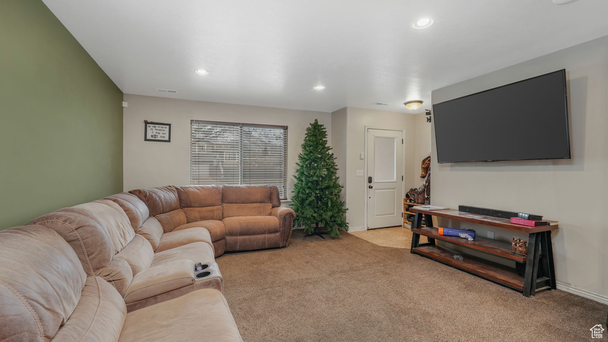 View of carpeted living room and mountain view