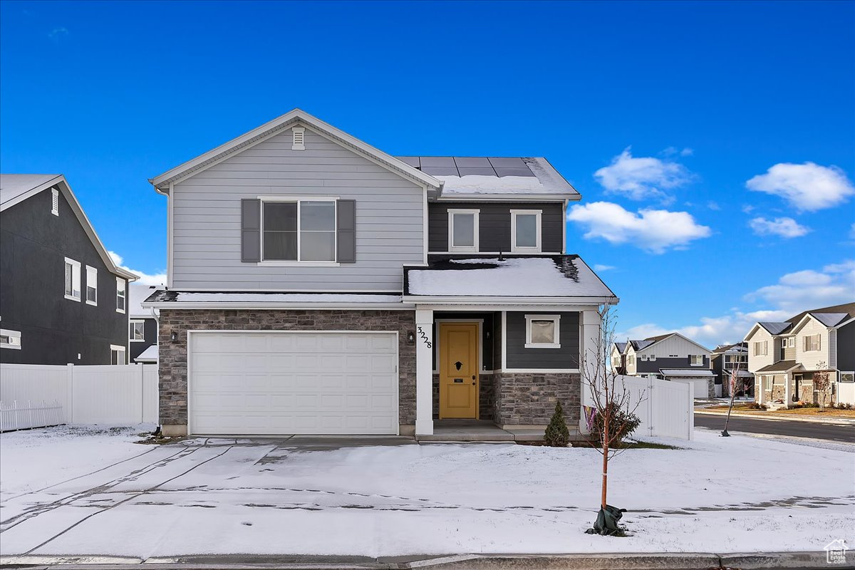 Front of property with a garage