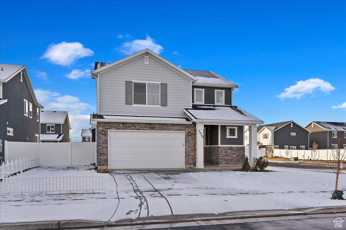 Front of property with a garage