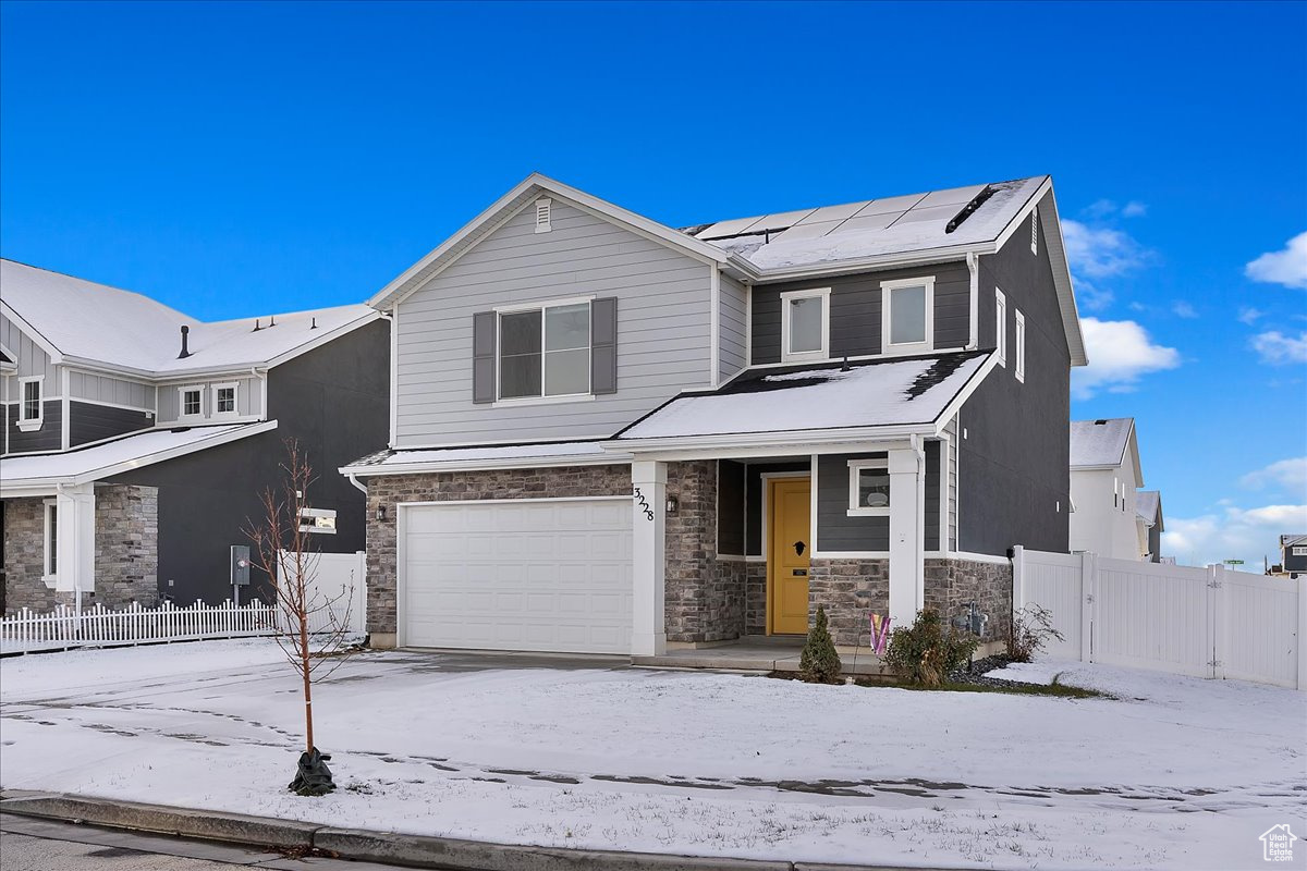 View of front of home featuring a garage