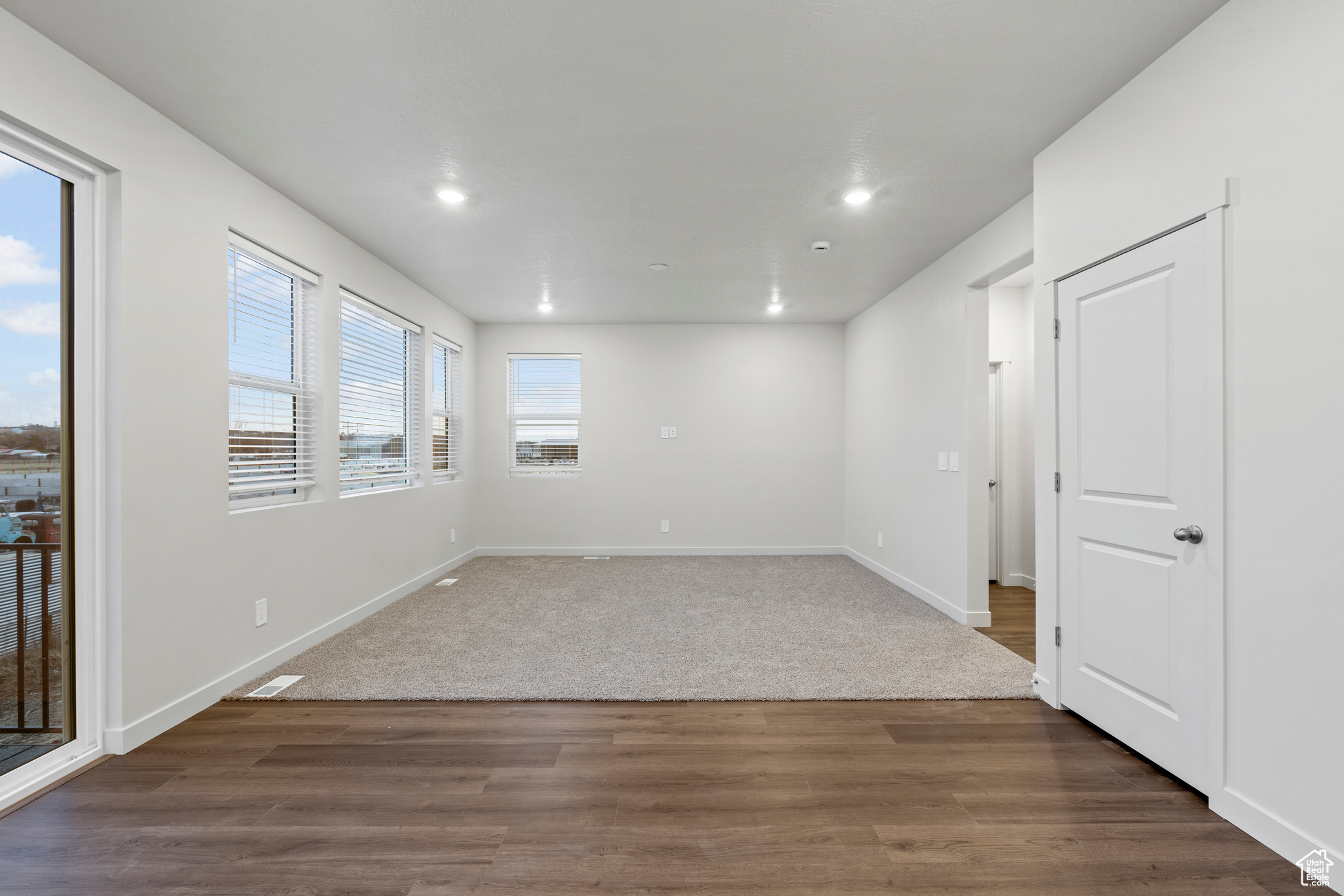 Spare room with dark wood-type flooring