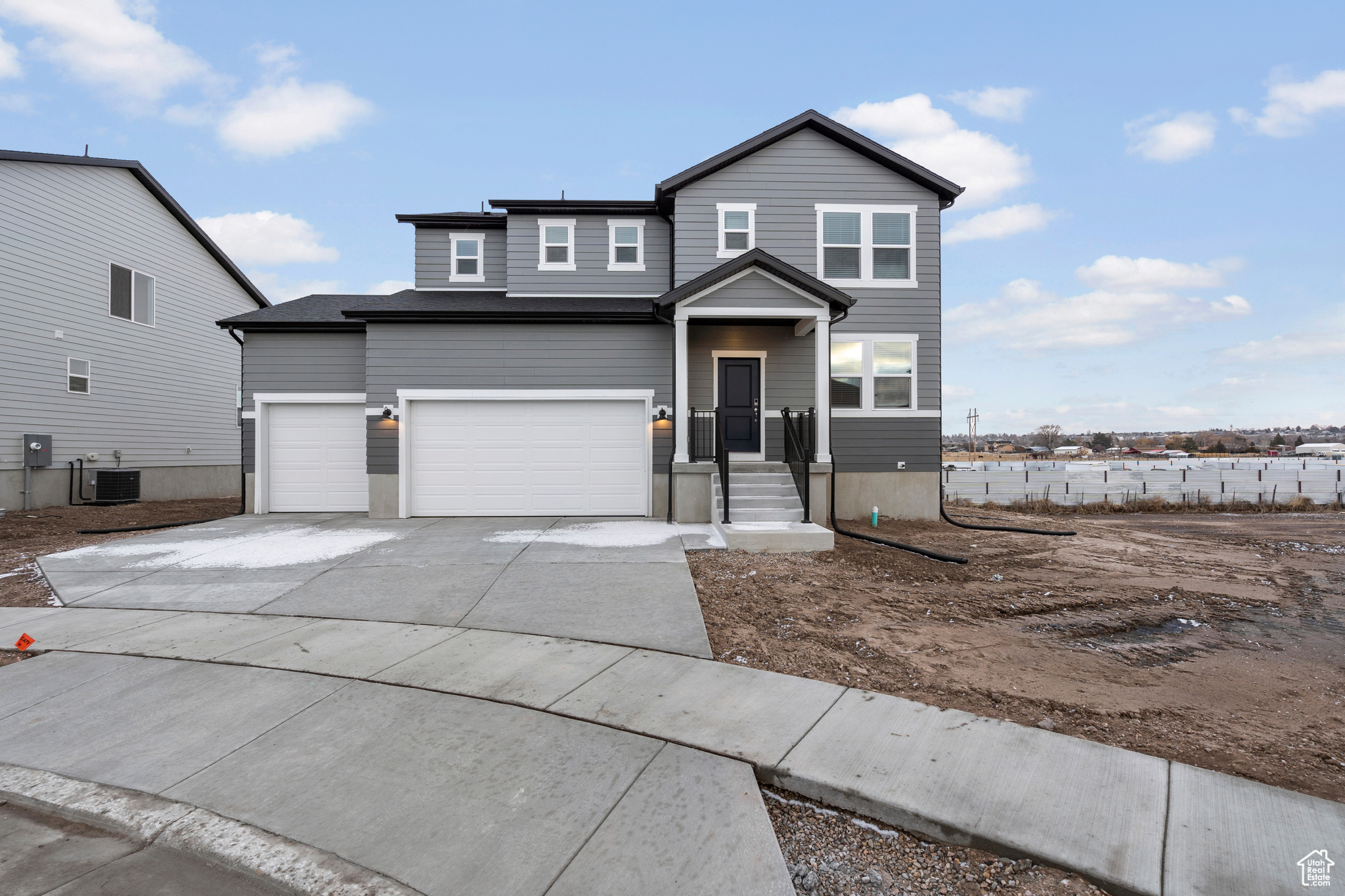 Front of property featuring central AC unit