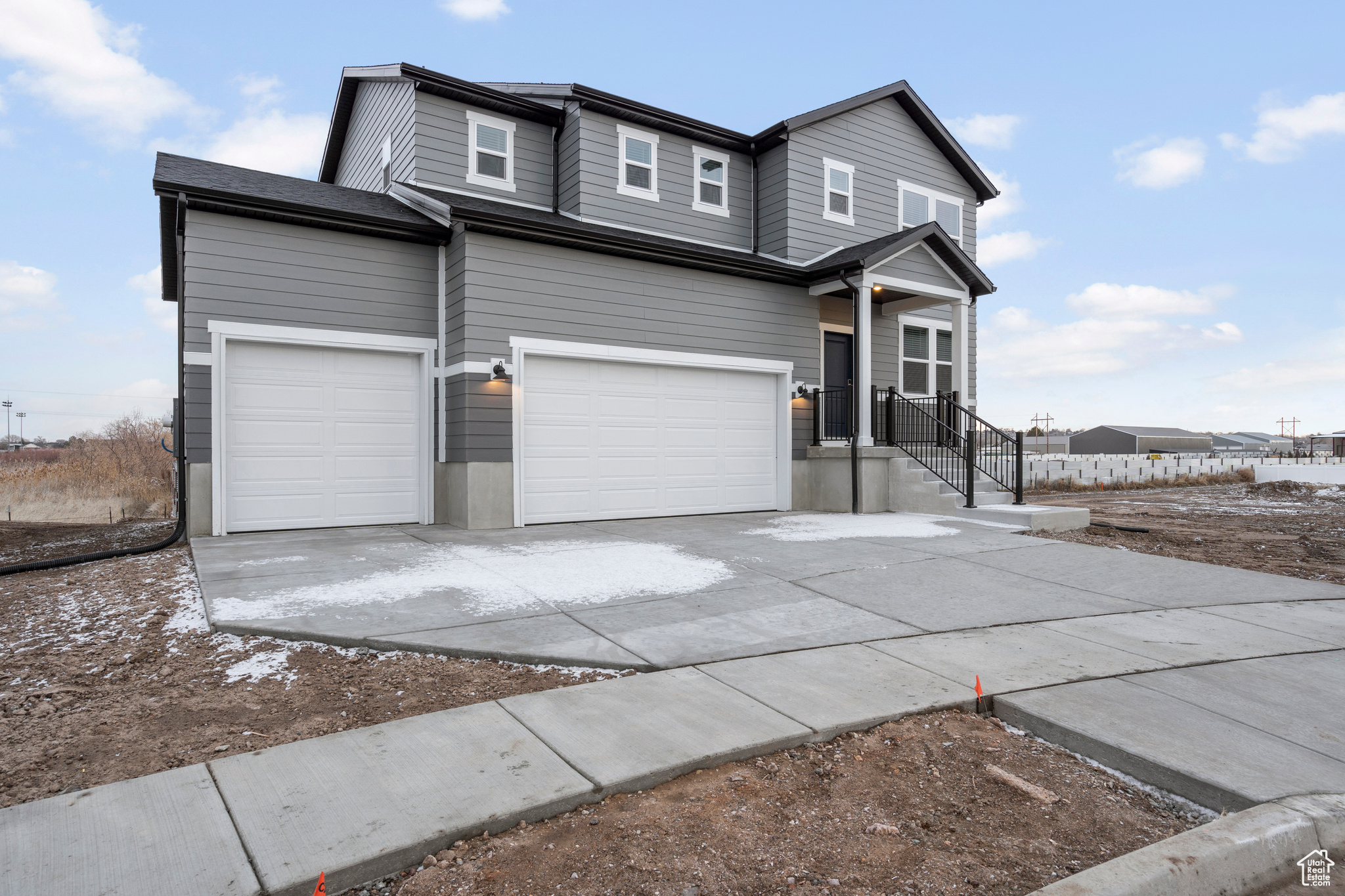 View of property with a garage