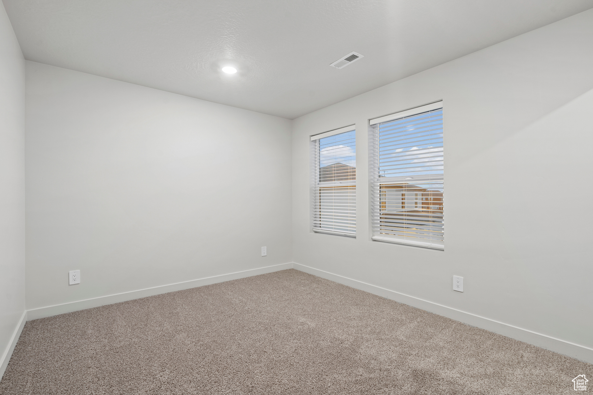 Empty room with carpet floors