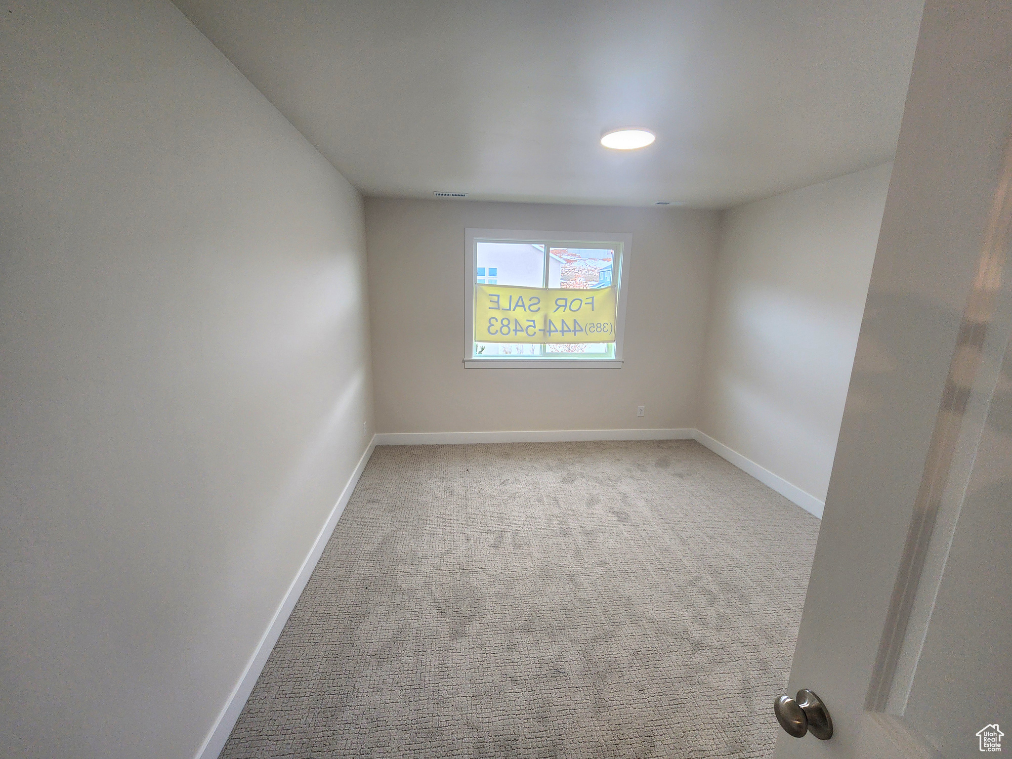 Empty room with carpet flooring