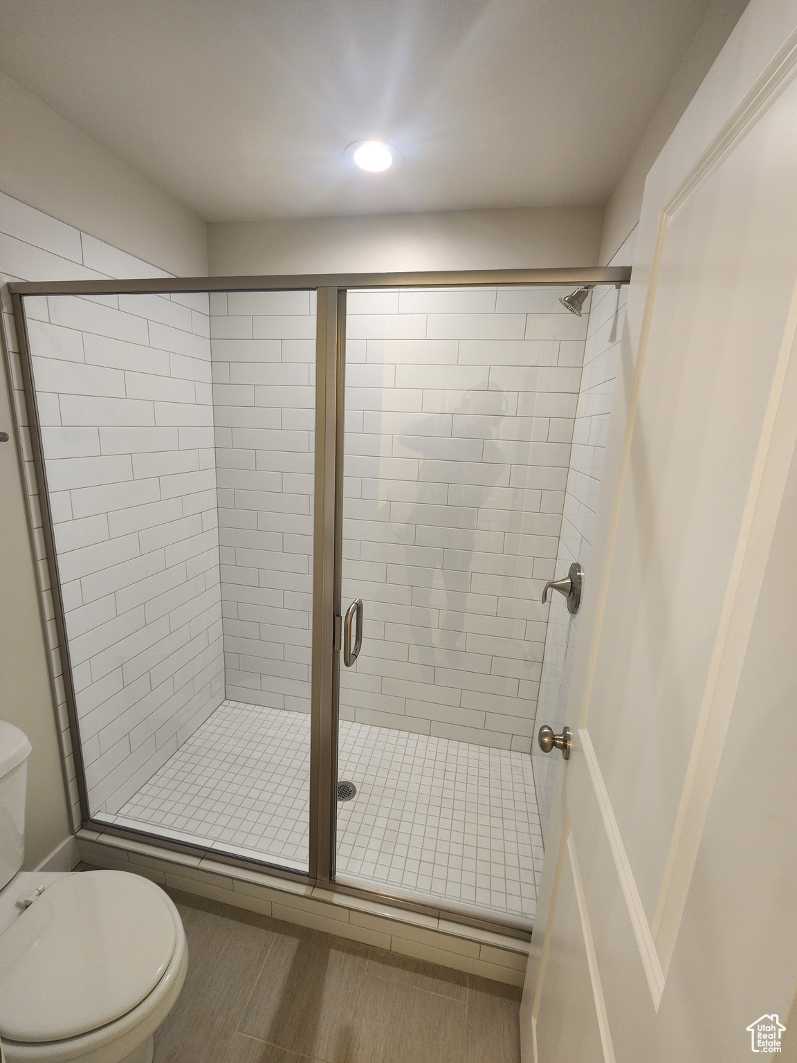 Bathroom with toilet and walk in shower