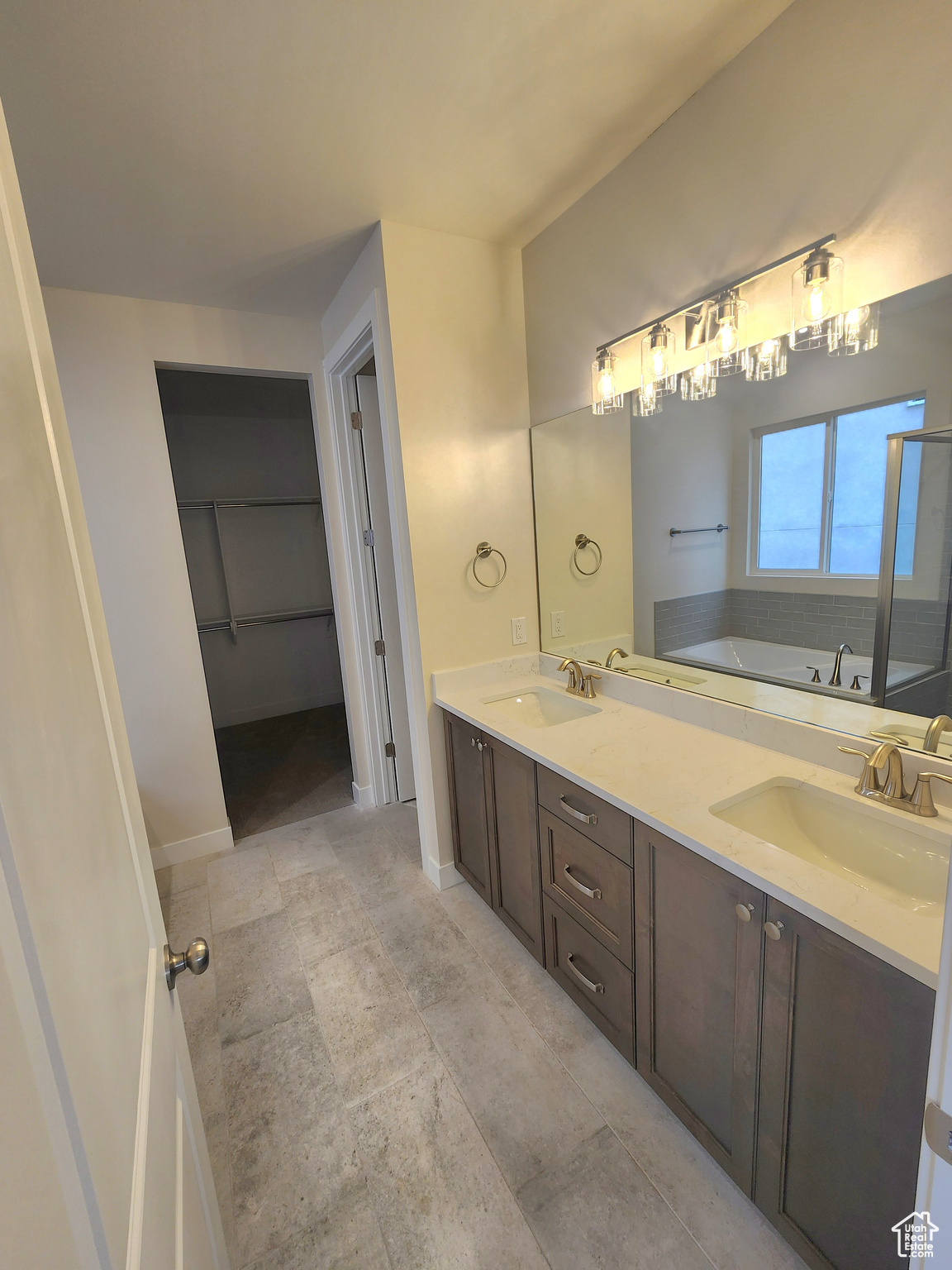 Bathroom with vanity and a bathtub