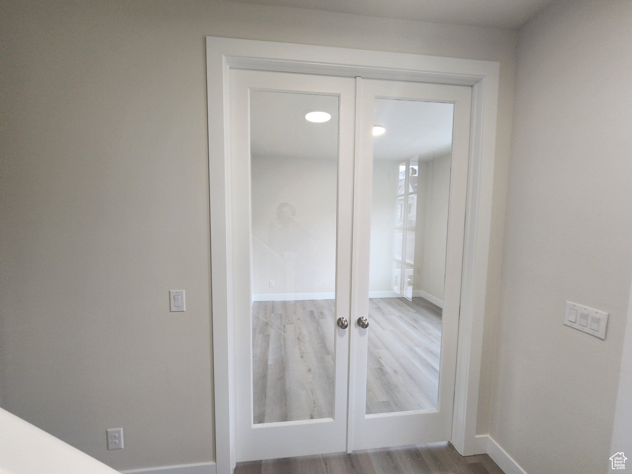 Interior space featuring french doors and wood-type flooring