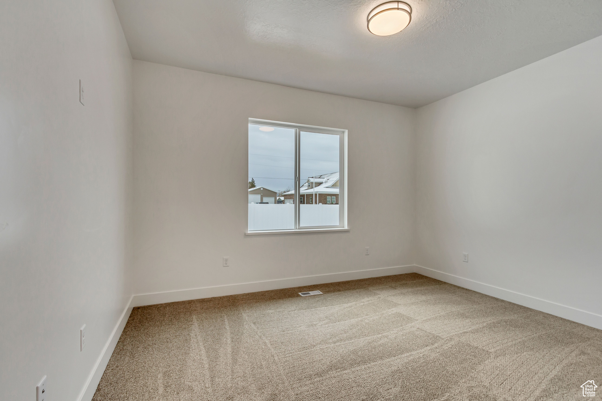 Spare room with carpet floors