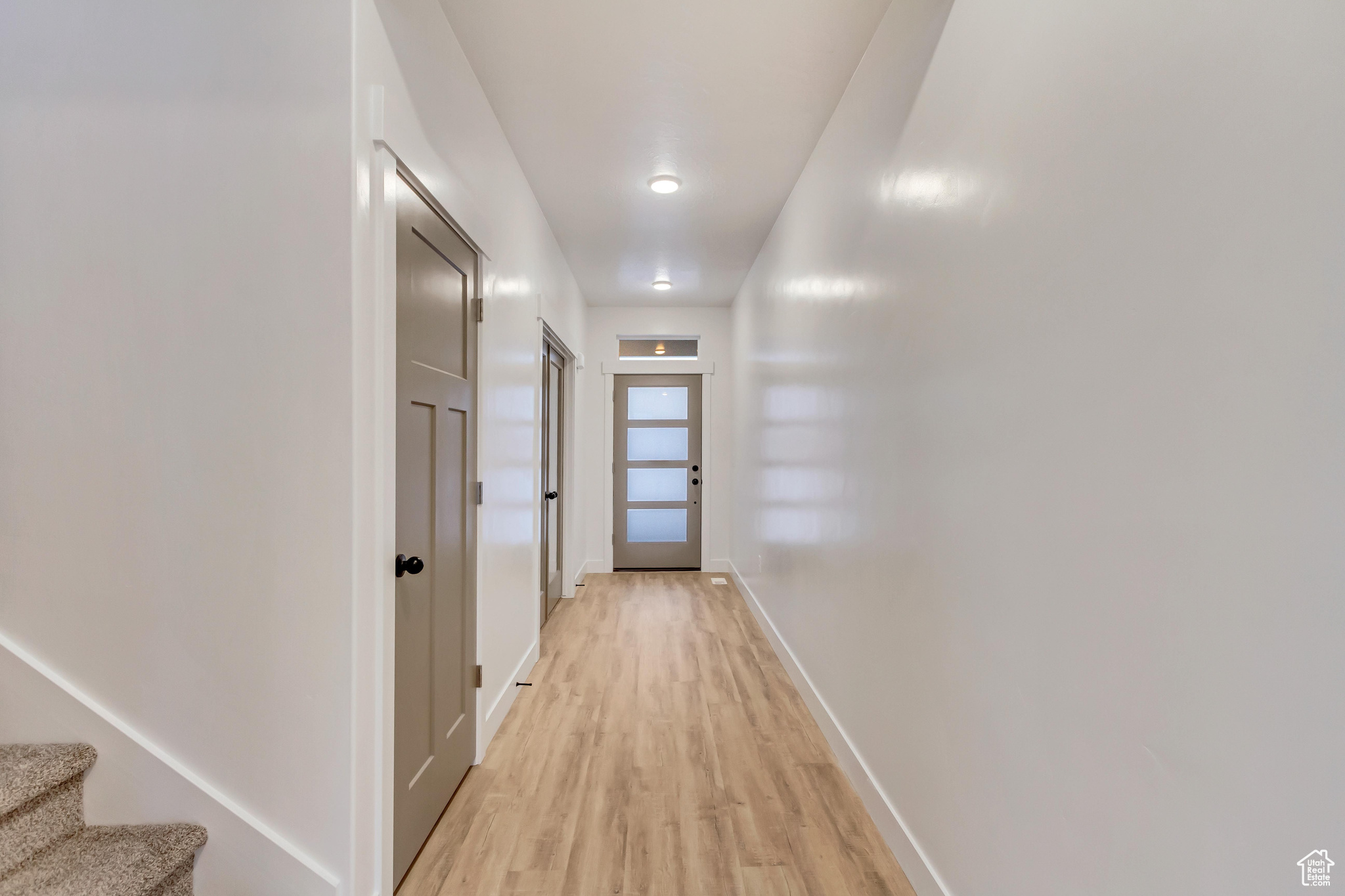 Hallway featuring light wood-type flooring