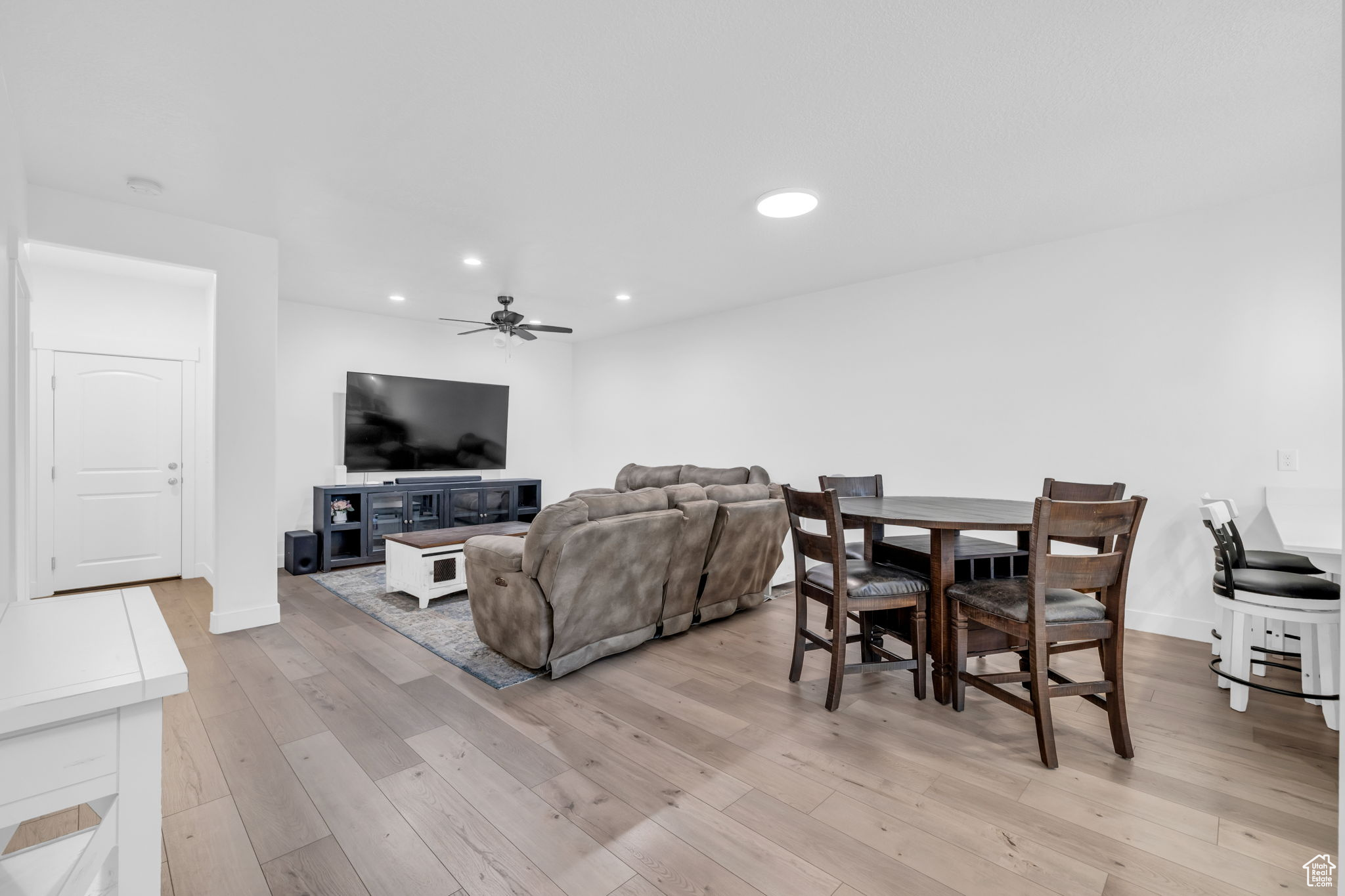 Interior space with light hardwood / wood-style floors and ceiling fan