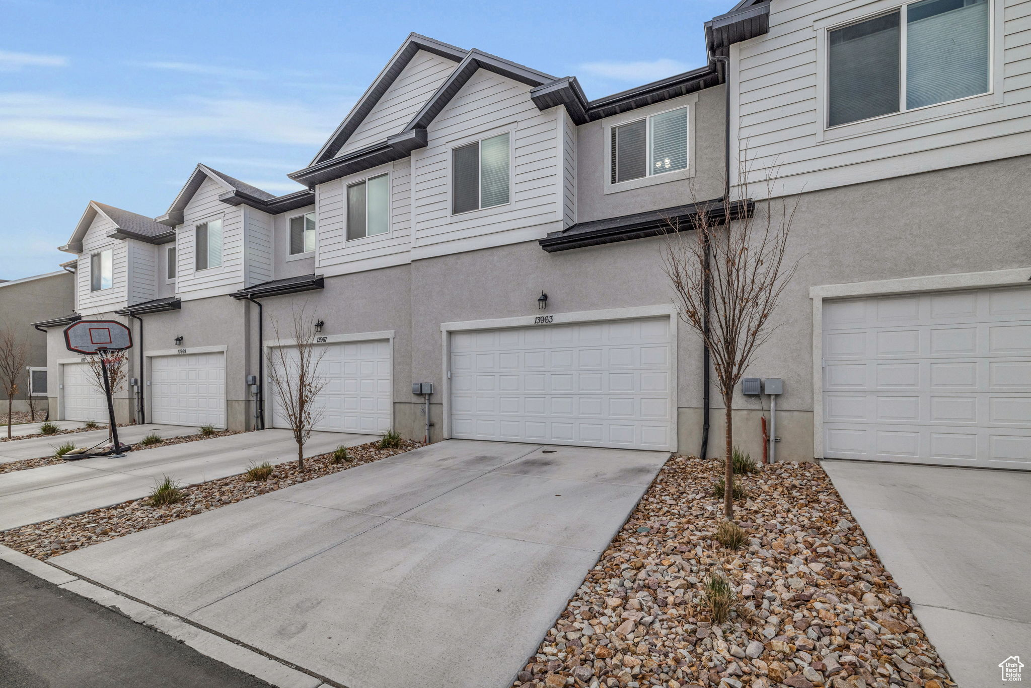 Townhome / multi-family property featuring a garage