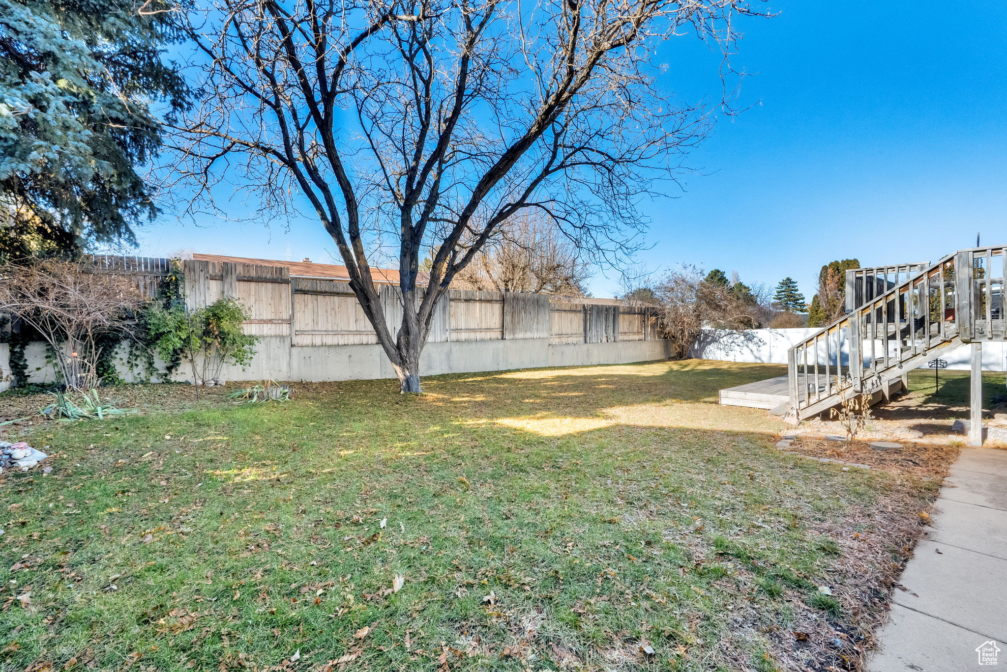 View of yard with a wooden deck