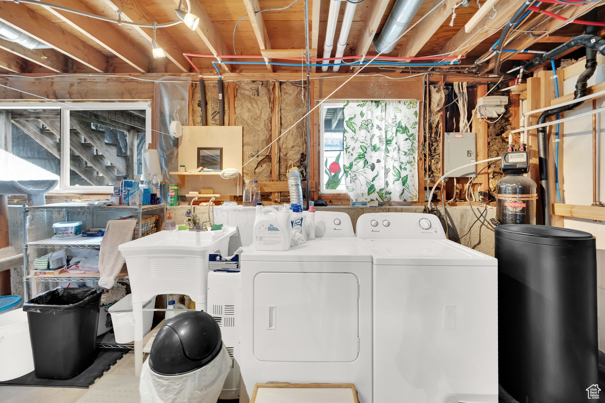 Laundry room featuring washer and clothes dryer and sink