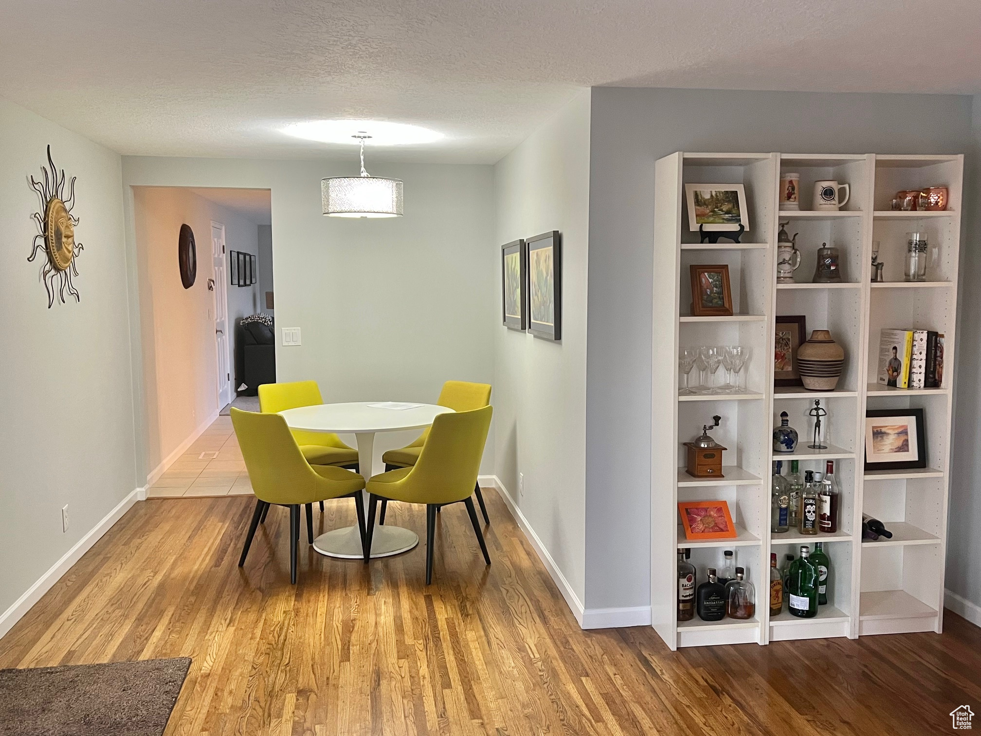 Dining room featuring a textured ceiling and hardwood / wood-style flooring