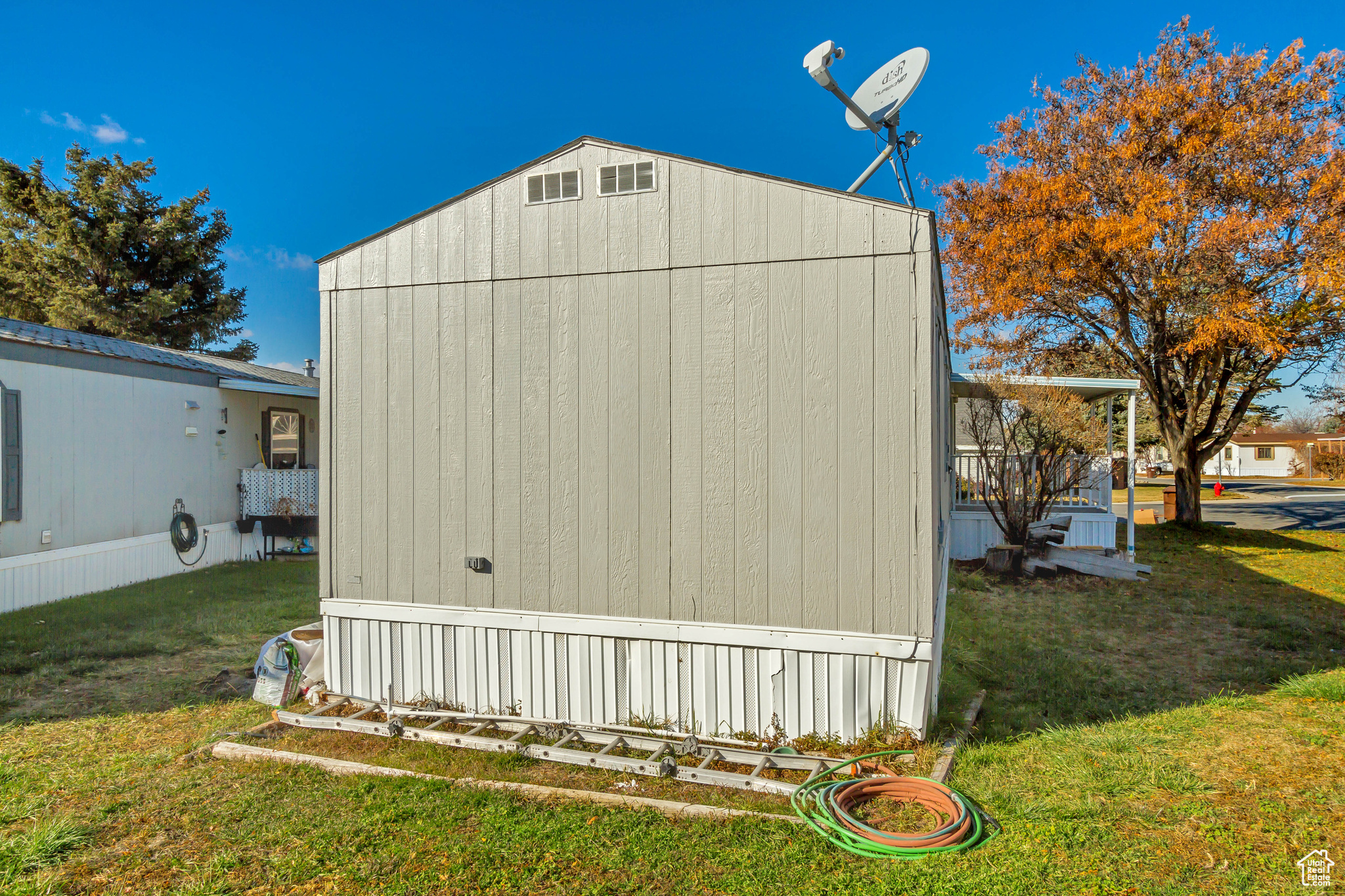 View of outdoor structure with a lawn