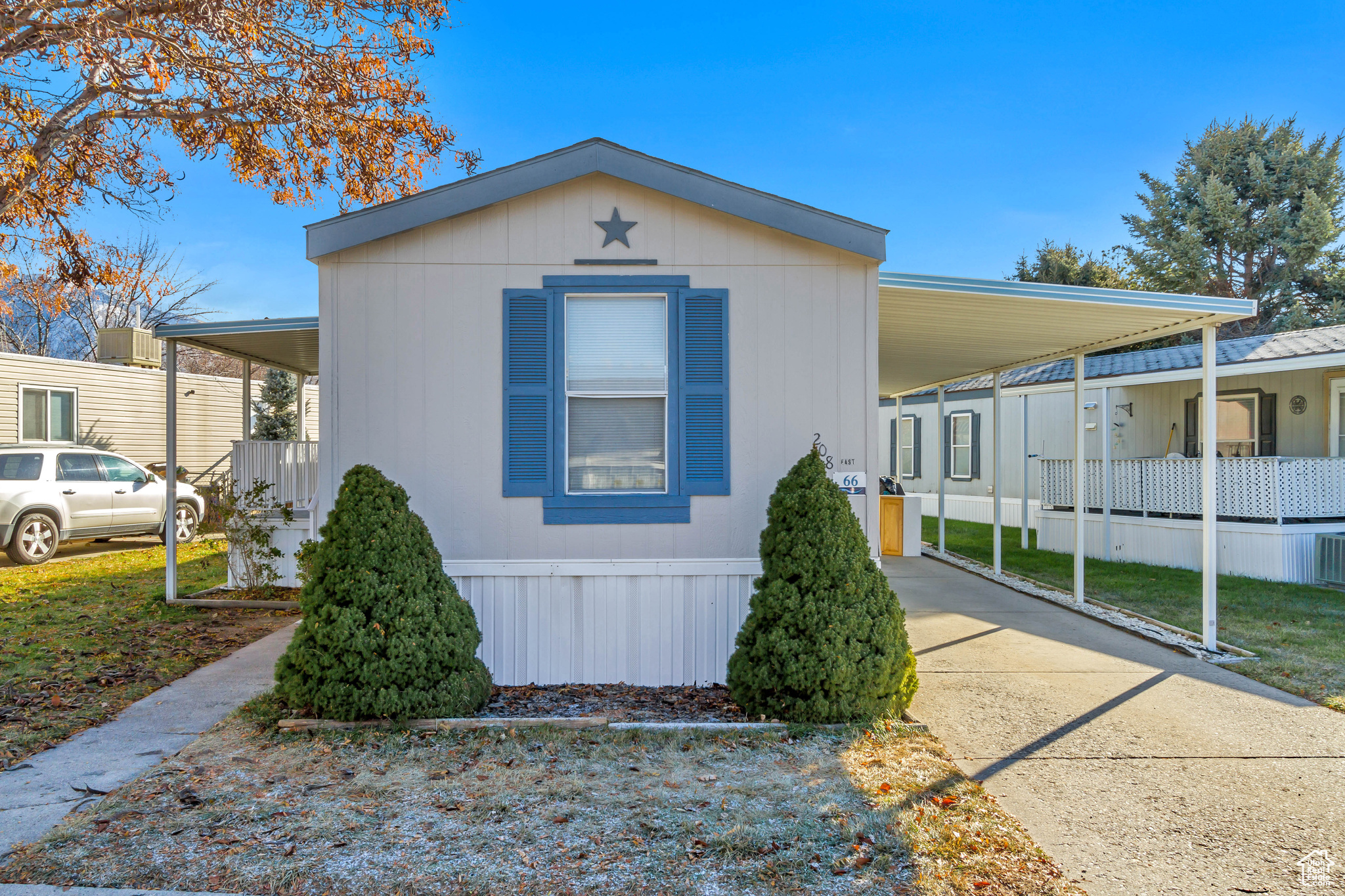 View of side of home featuring a carport