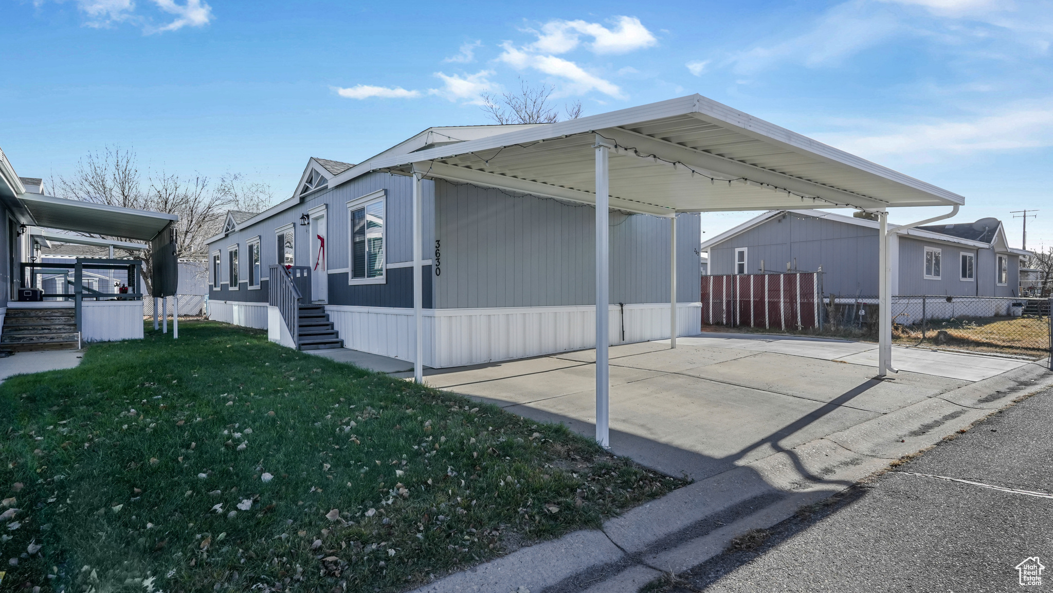 View of side of property featuring a yard