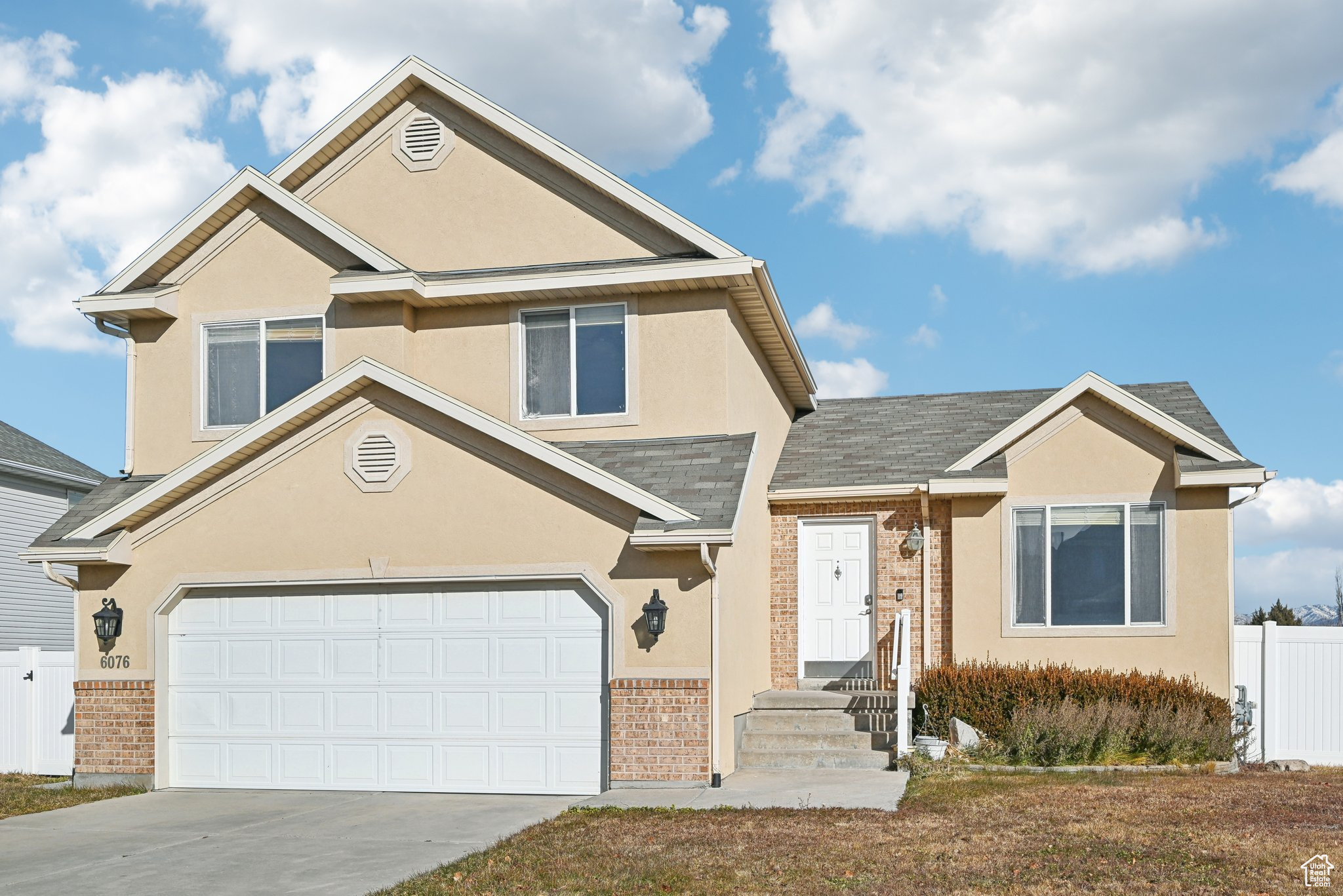 View of front facade featuring a garage