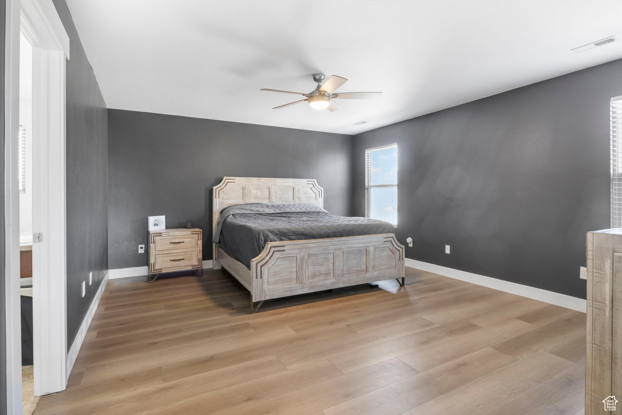 Bedroom with light wood-type flooring and ceiling fan