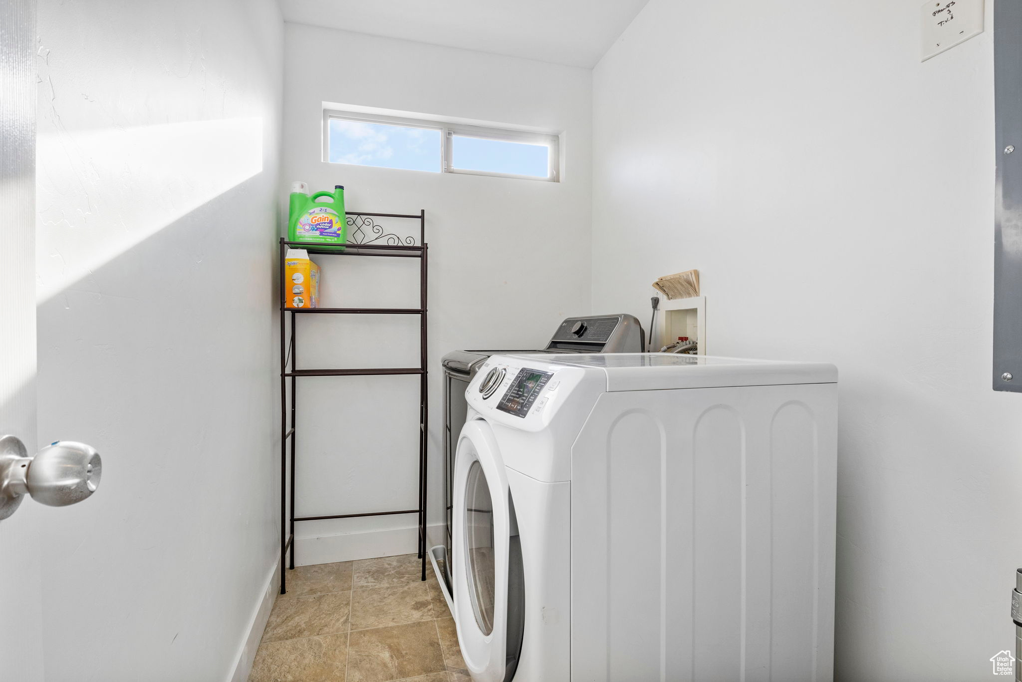 Clothes washing area featuring independent washer and dryer