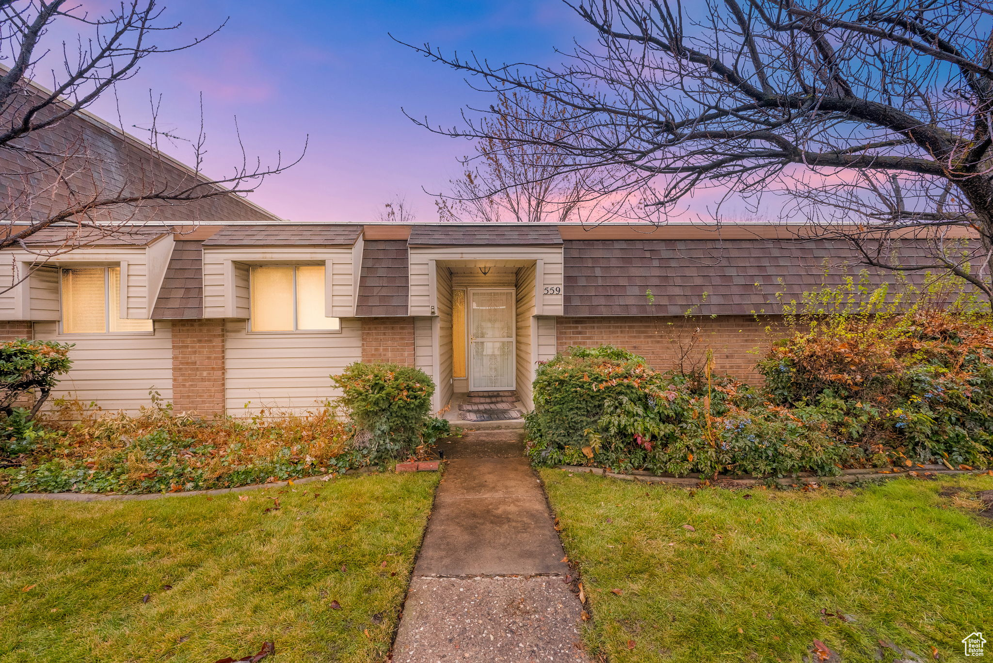 View of front of home featuring a lawn