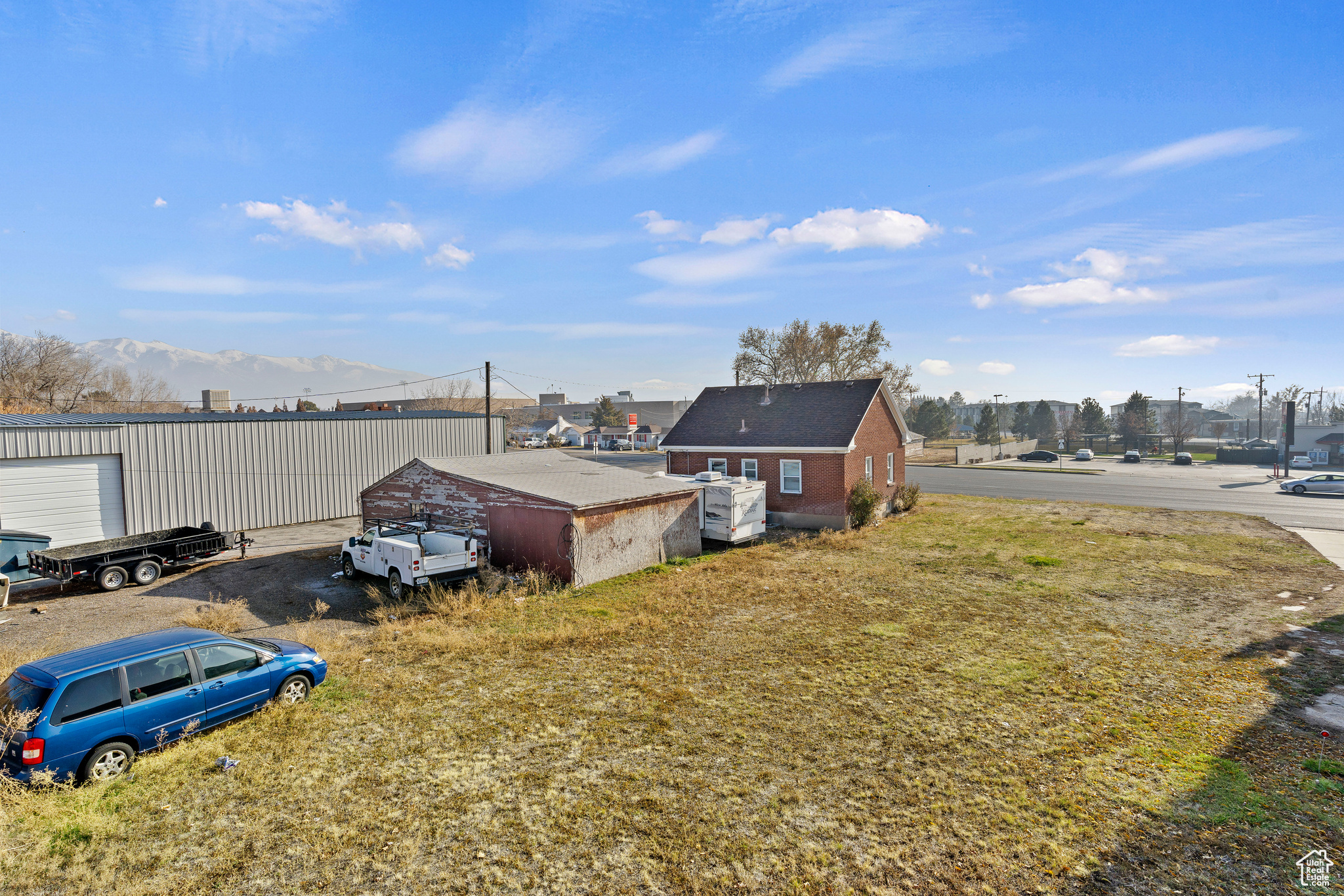 View of yard with a mountain view and an outdoor structure