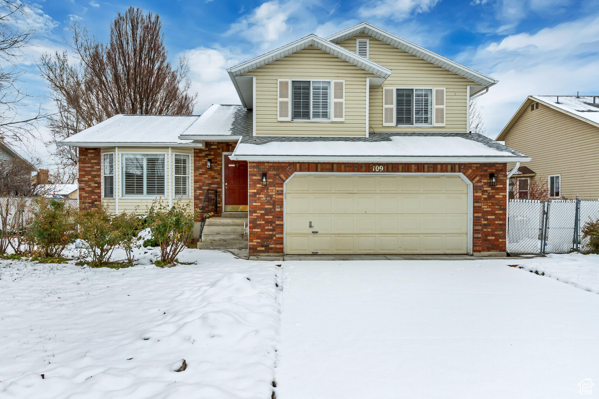 Split level home featuring a garage