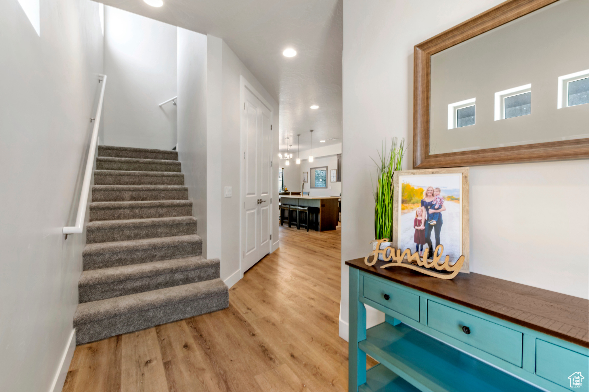 Stairs with hardwood / wood-style floors