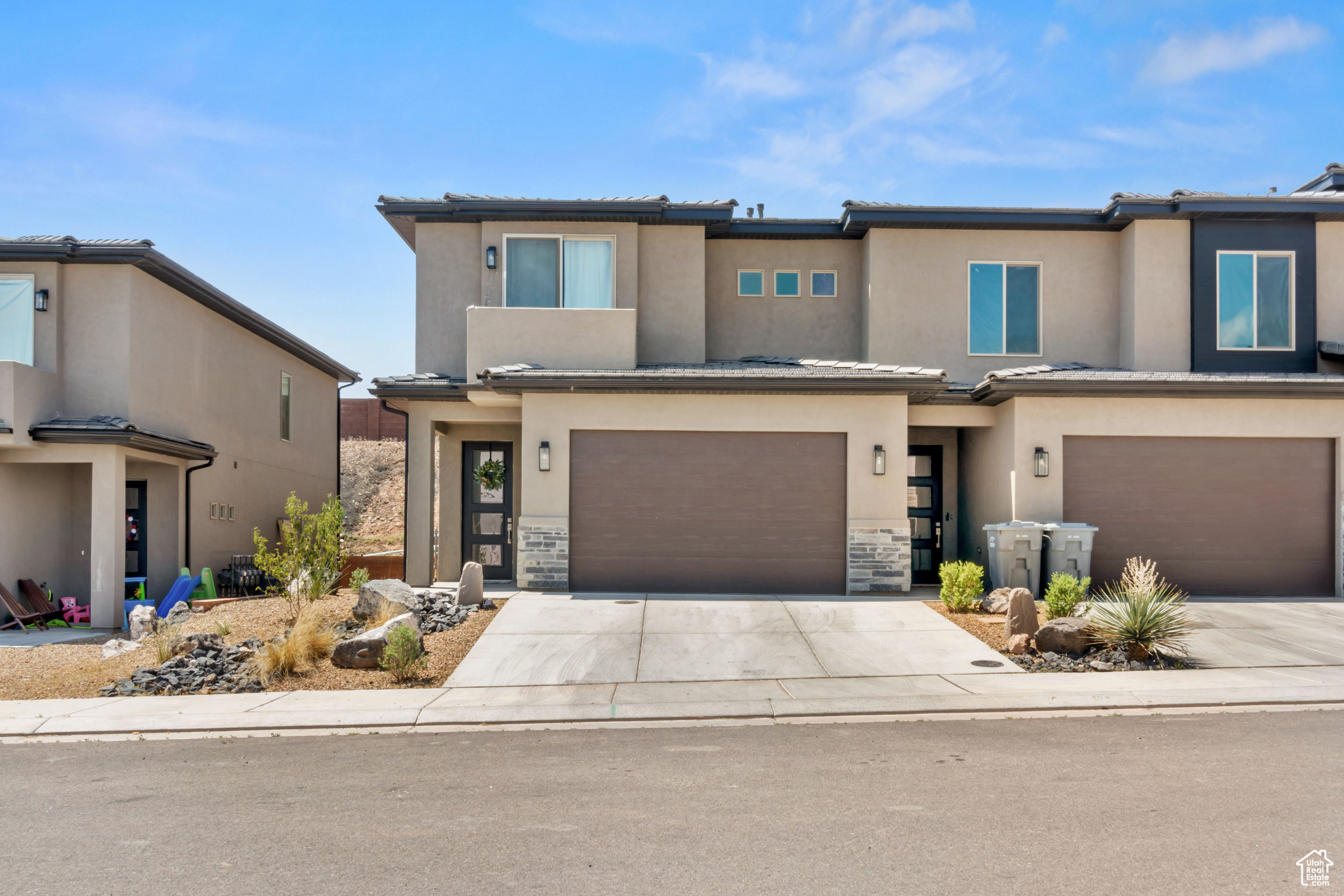 View of front facade featuring a garage