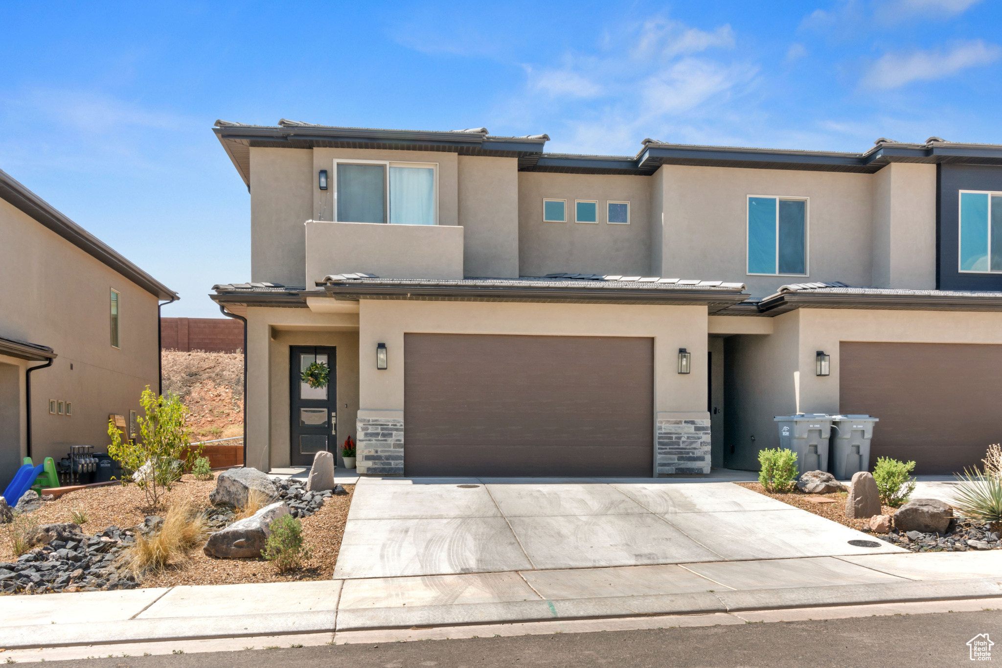 View of front of property featuring a garage